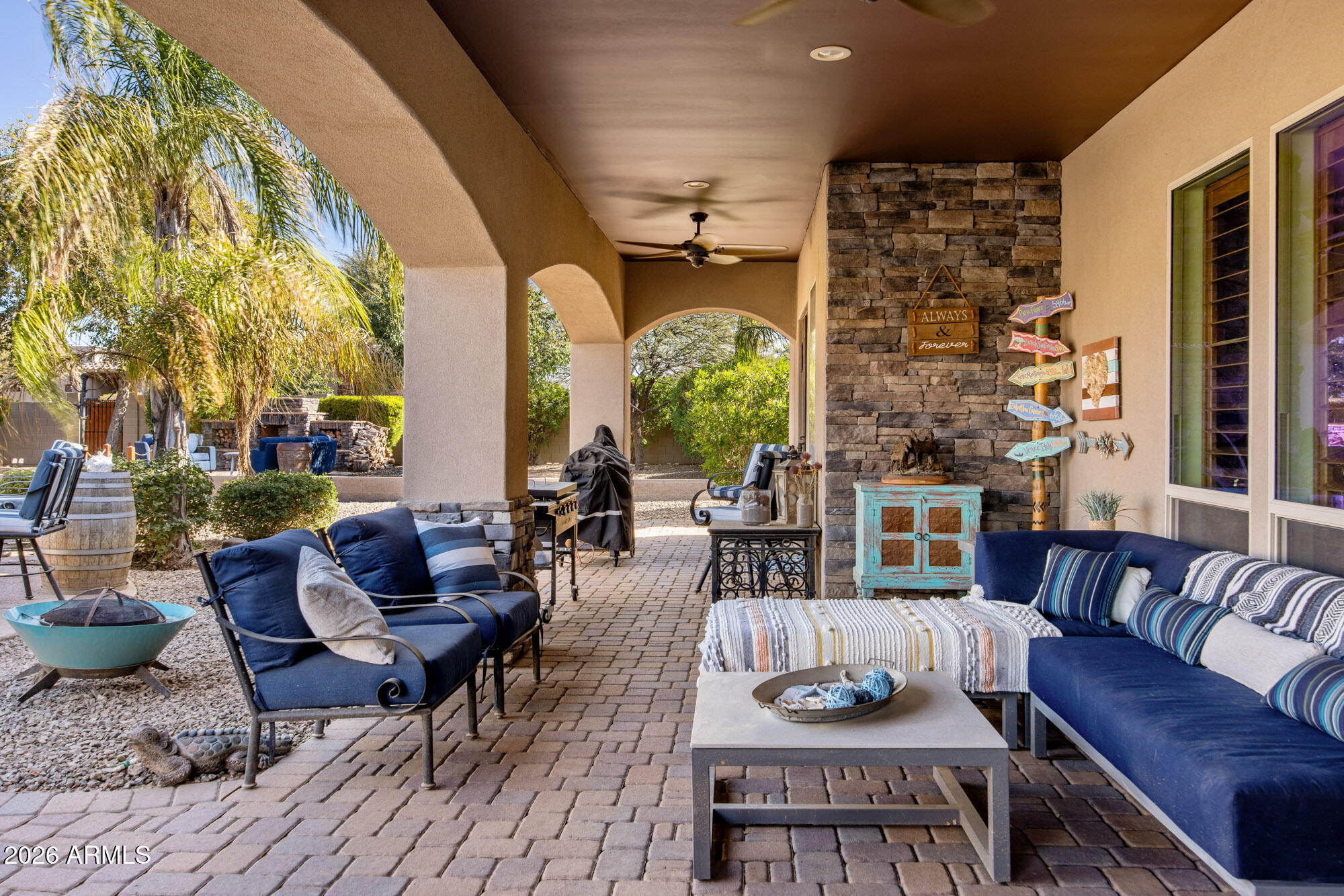 1406 West Joy Ranch Road Phoenix, AZ 85086 - Photo 47 of 58 a outdoor space with patio the couches and a dining table with garden view