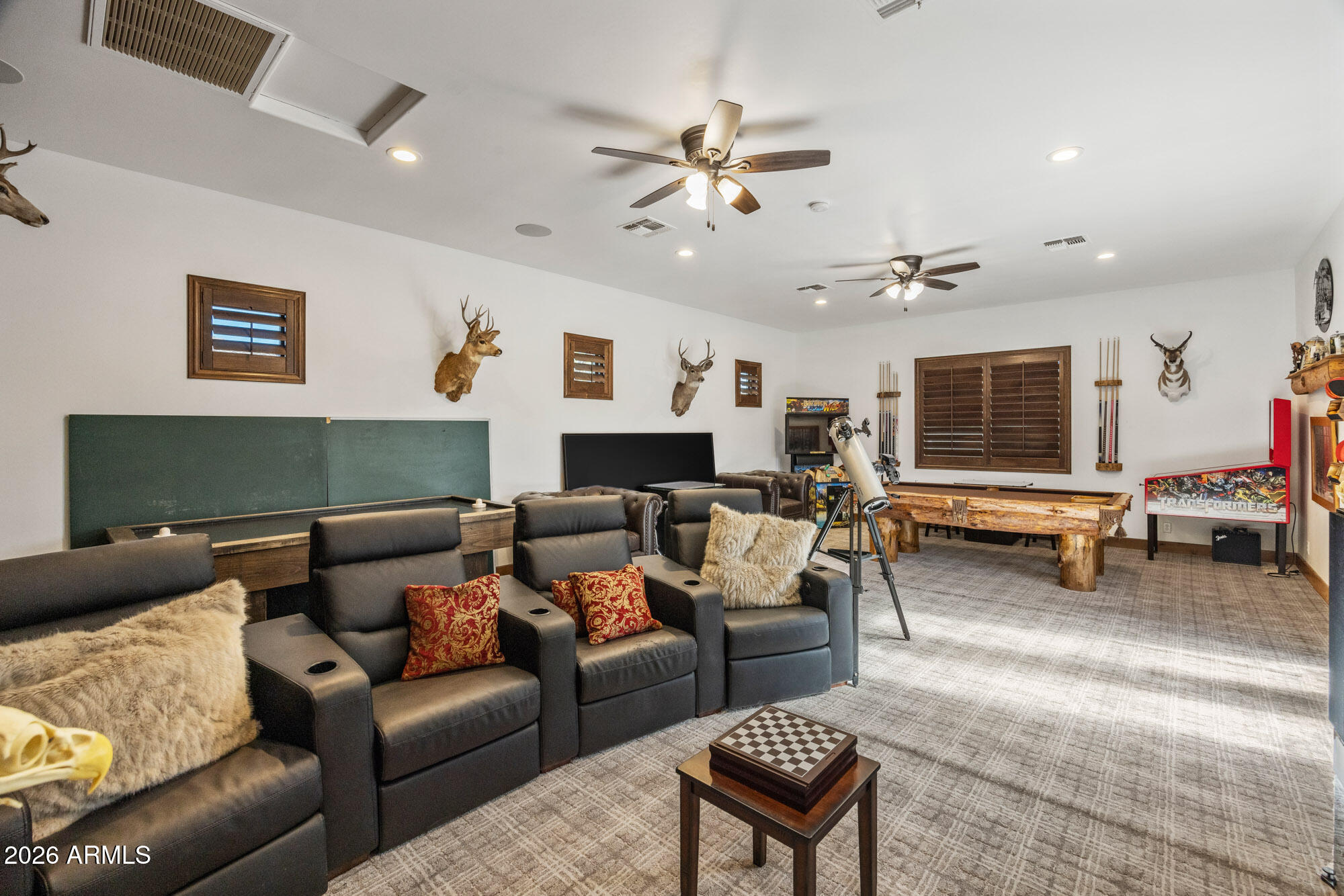 1406 West Joy Ranch Road Phoenix, AZ 85086 - Photo 52 of 58 a living room with furniture and a flat screen tv