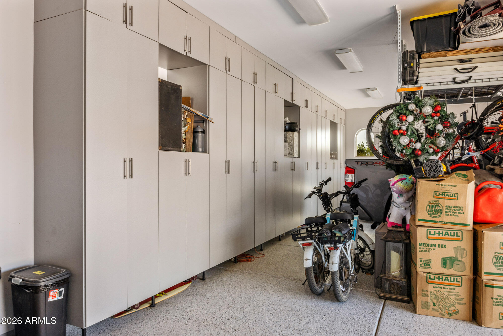 1406 West Joy Ranch Road Phoenix, AZ 85086 - Photo 58 of 58 a view of a storage room with a table and chairs