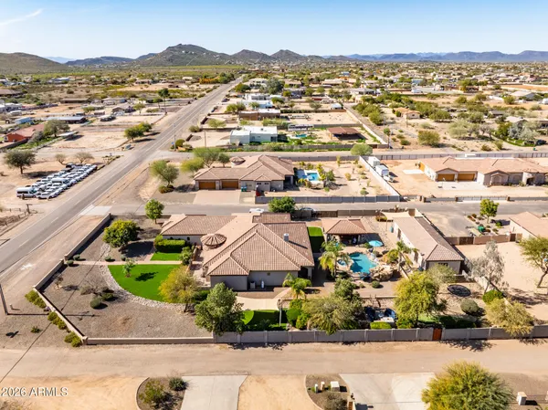 an aerial view of residential houses with outdoor space