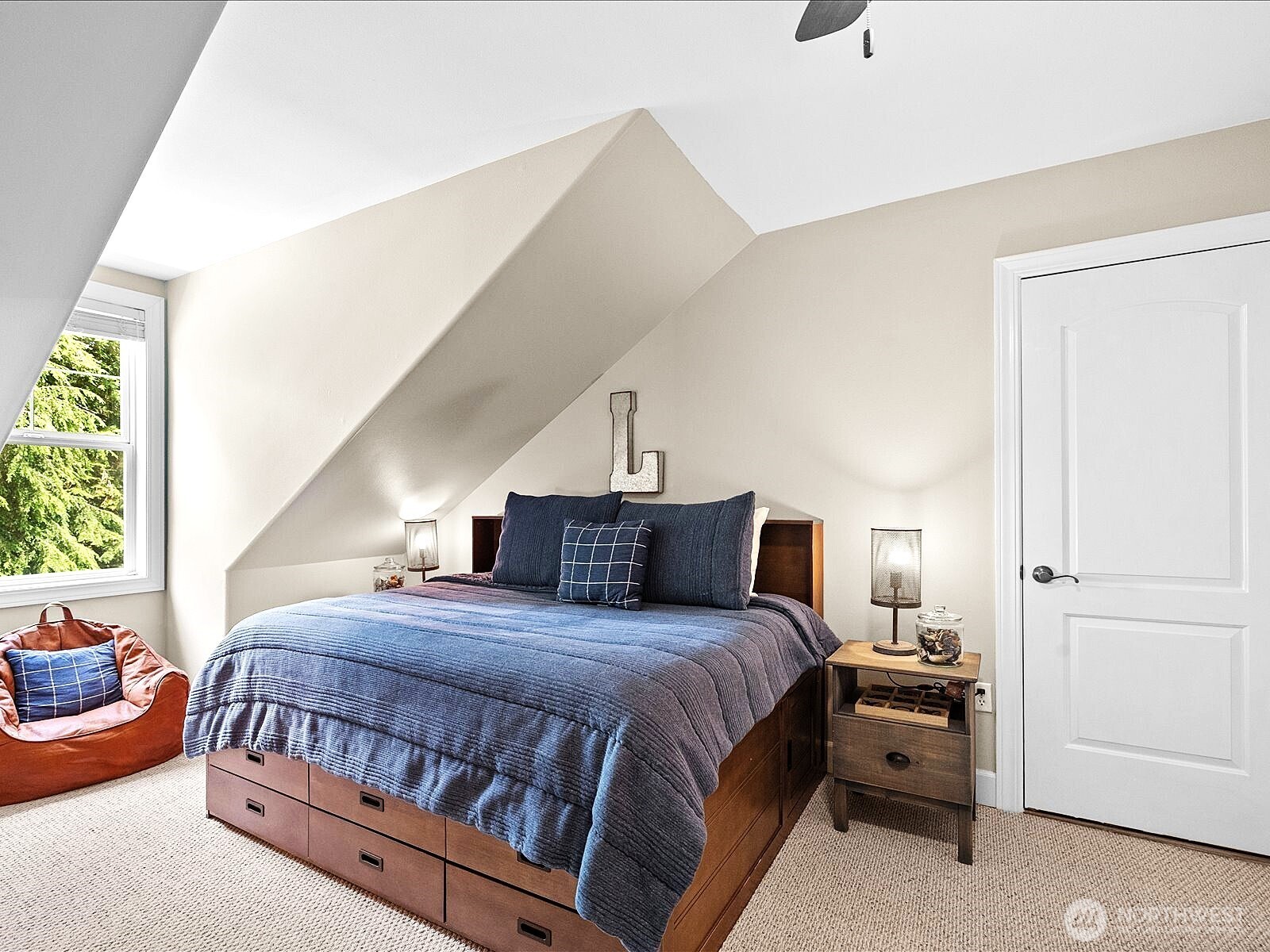 33606 Northeast Lake Joy Road Carnation, WA 98014 - Photo 28 of 40 a bedroom with a bed and window