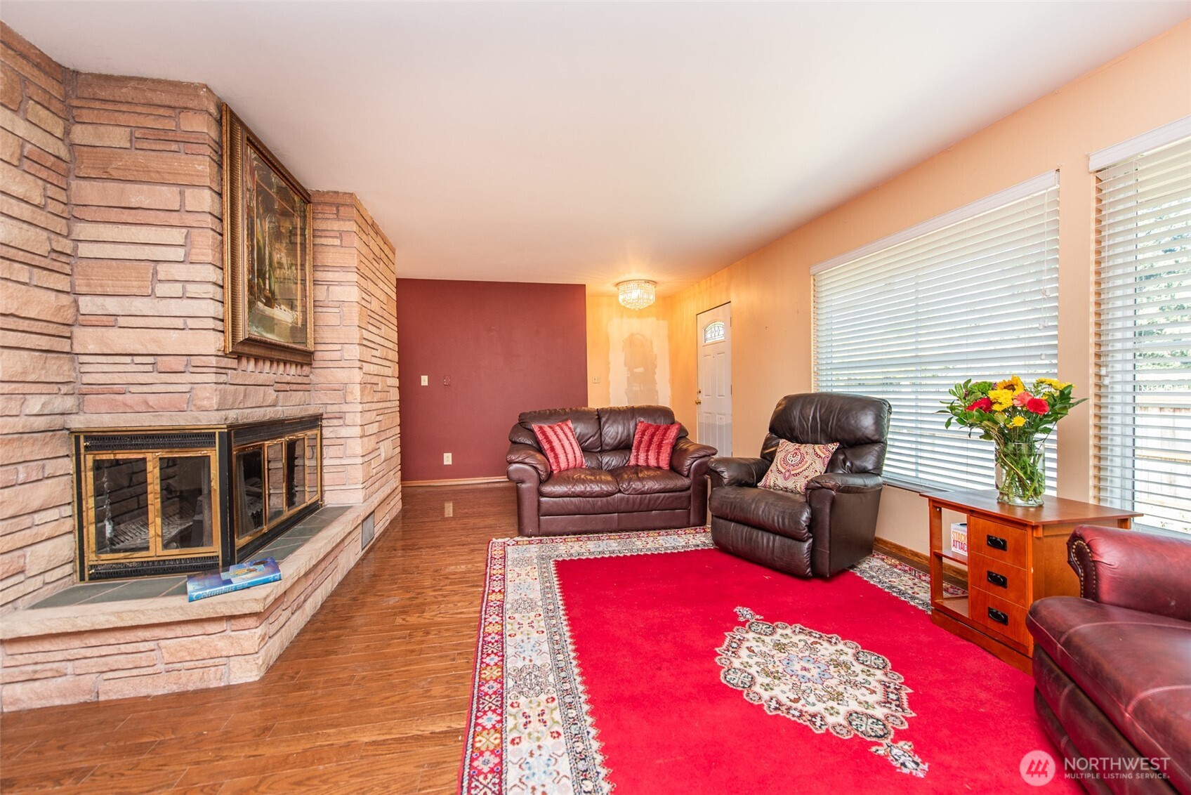 307 East Fir Street Sequim, WA 98382 - Photo 6 of 29 a living room with furniture a rug and a fireplace