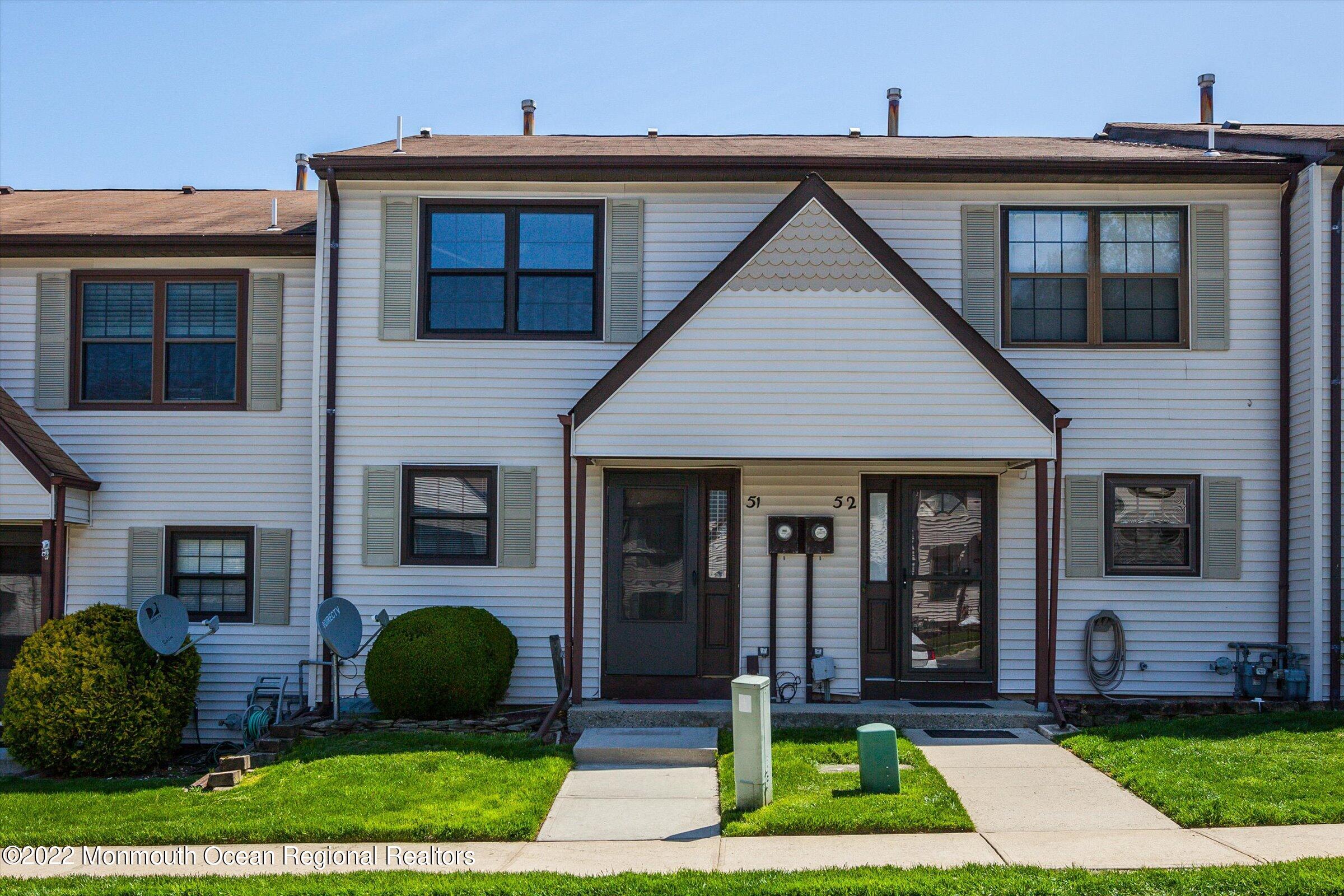 51 Queens Way Englishtown, NJ 07726 - Photo 1 of 25 a front view of a house with garden