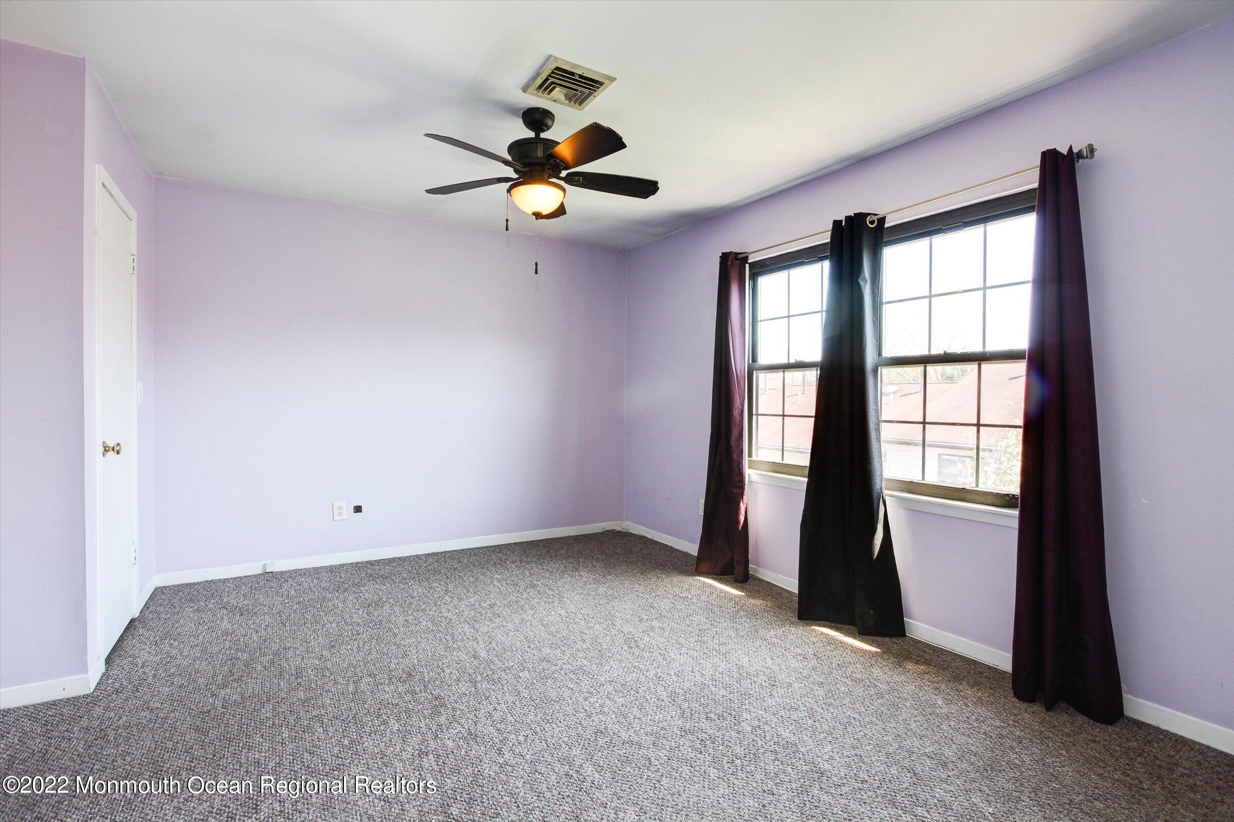 51 Queens Way Englishtown, NJ 07726 - Photo 18 of 25 a view of an empty room with a window