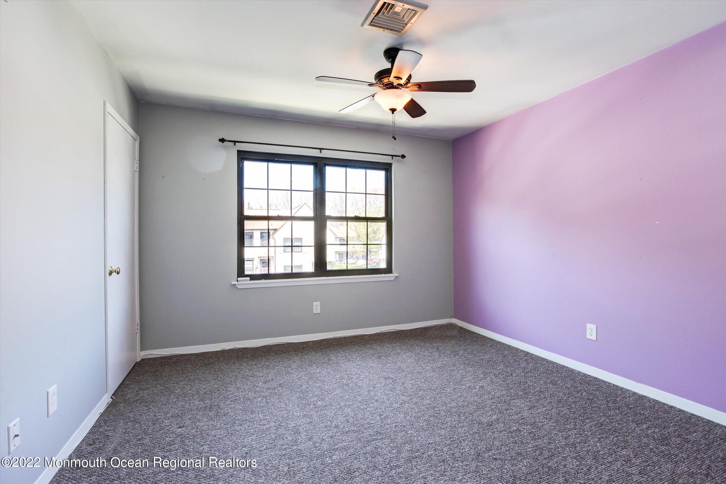 51 Queens Way Englishtown, NJ 07726 - Photo 20 of 25 wooden floor in an empty room with a window
