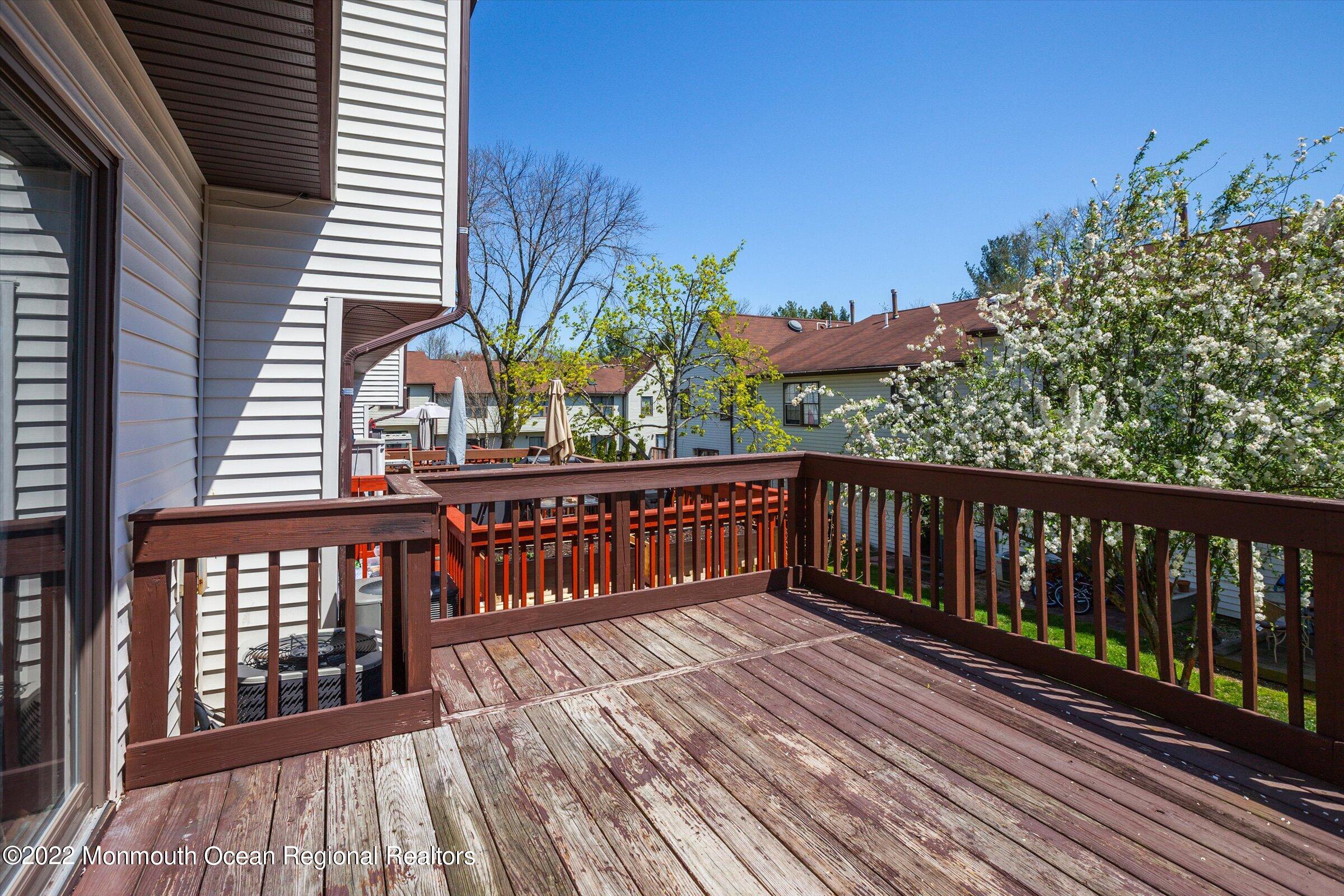 51 Queens Way Englishtown, NJ 07726 - Photo 24 of 25 a view of a wooden deck with a yard