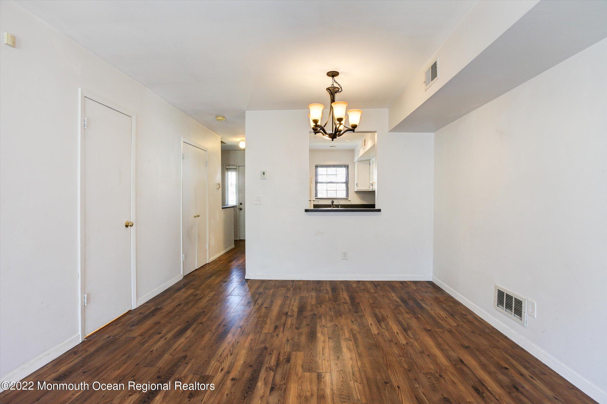 51 Queens Way Englishtown, NJ 07726 - Photo 10 of 25 a view of empty room with wooden floor