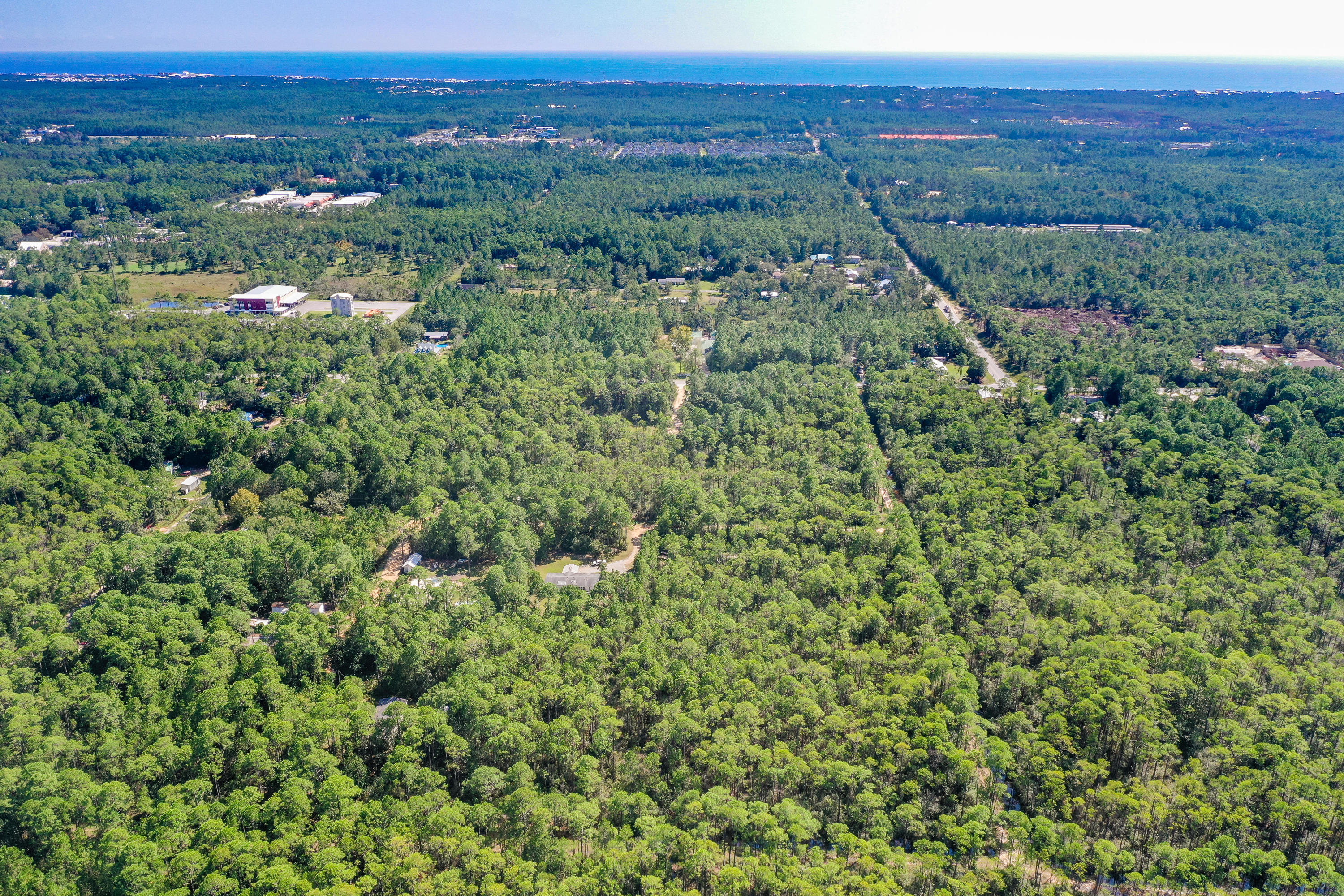 Lot 3 North 15th Street Santa Rosa Beach, FL 32459 - Photo 6 of 18 a view of a lush green forest with trees and houses