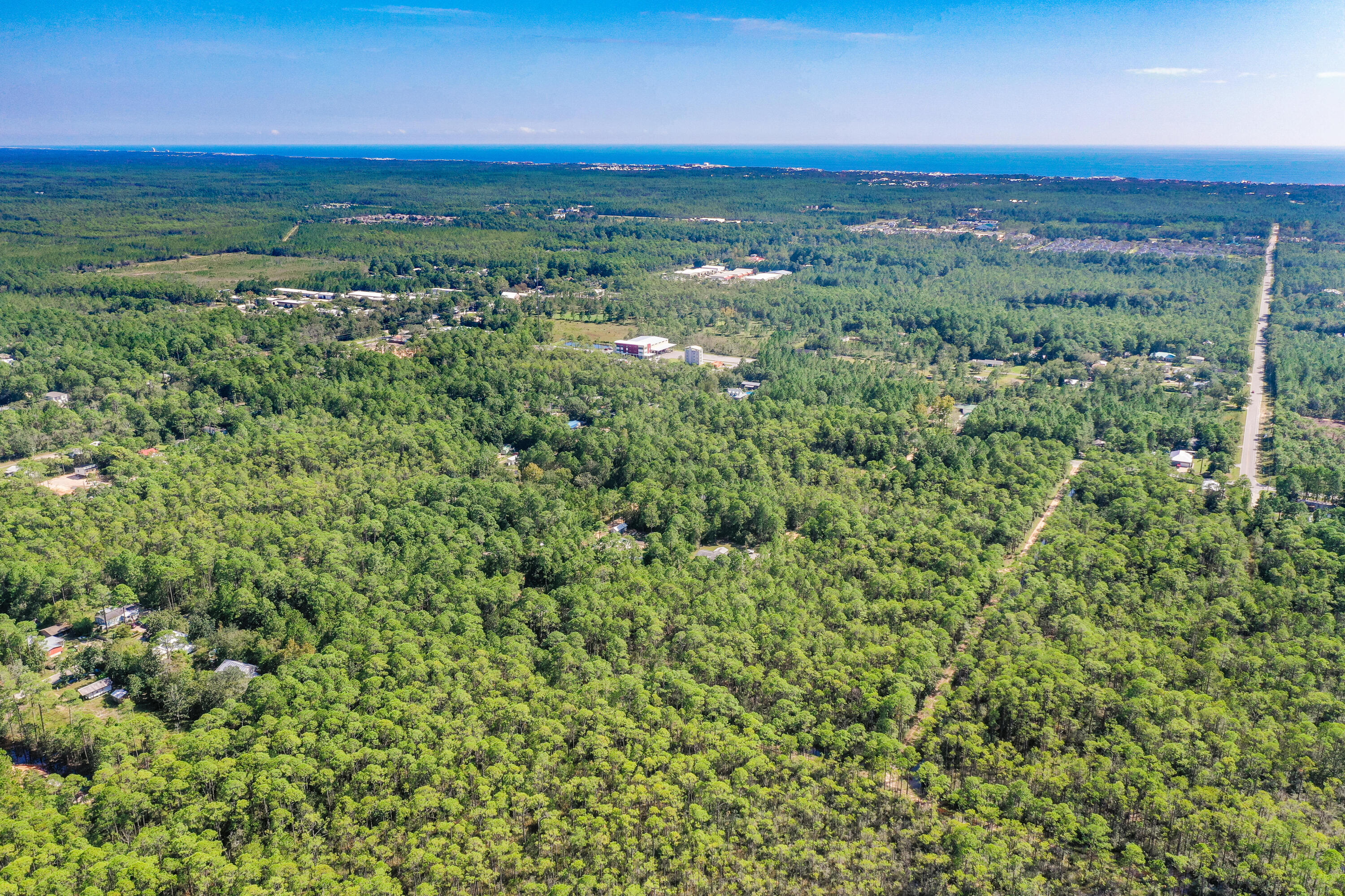 Lot 3 North 15th Street Santa Rosa Beach, FL 32459 - Photo 7 of 18 a view of a city with lush green forest