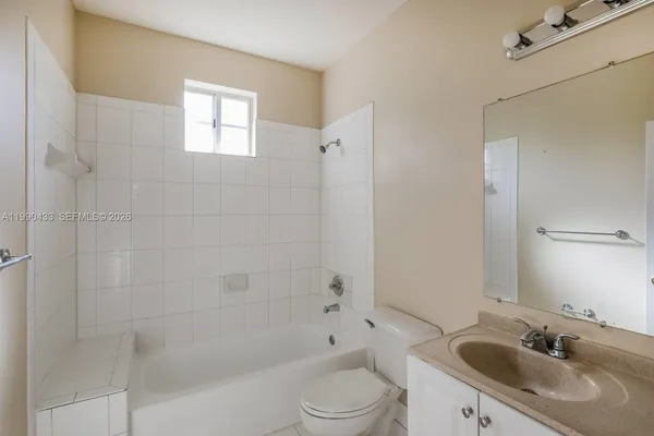 a bathroom with a sink toilet a shower and bathtub