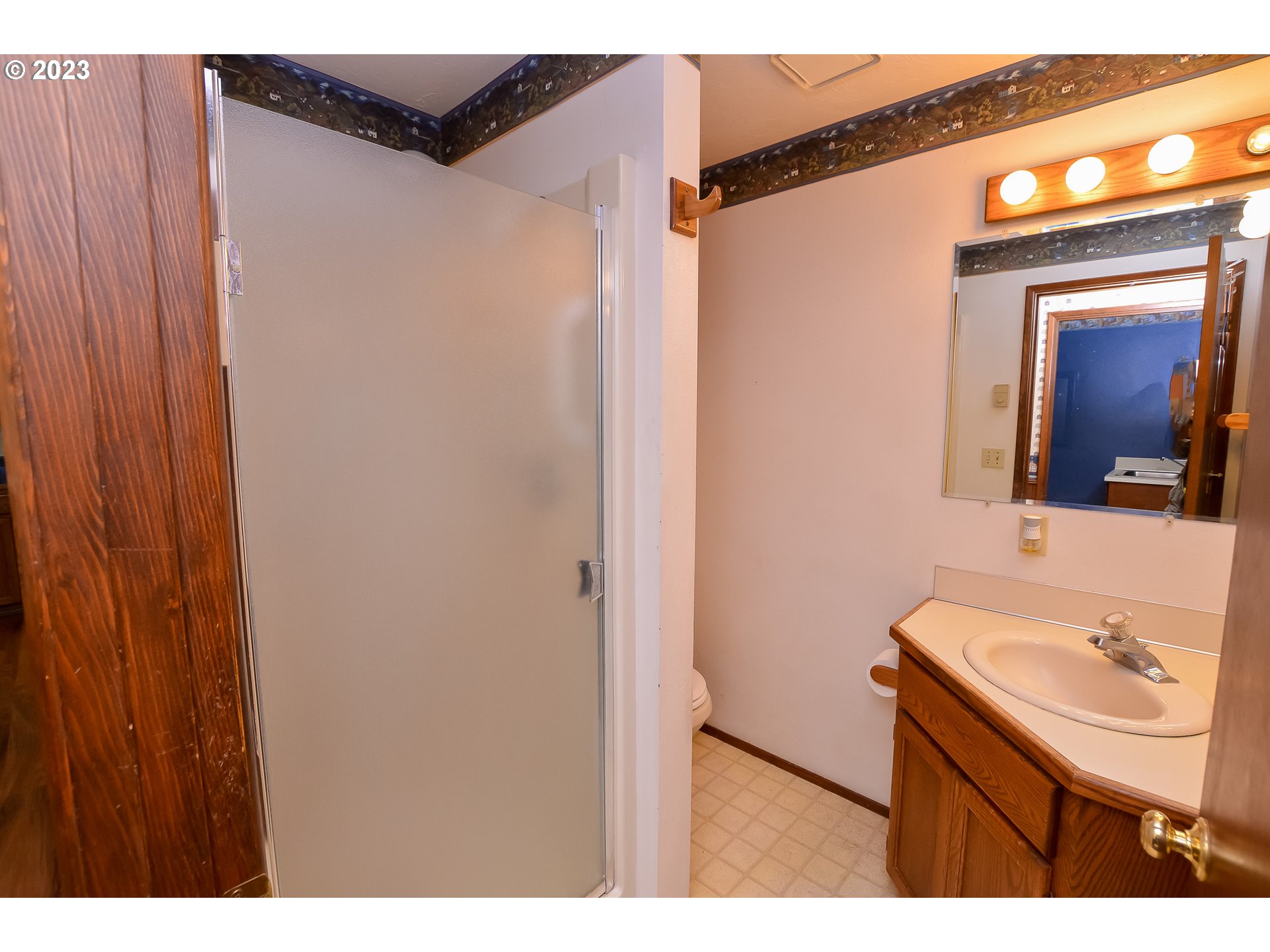 2470 16th Street Springfield, OR 97477 - Photo 15 of 32 a bathroom with a sink and a mirror
