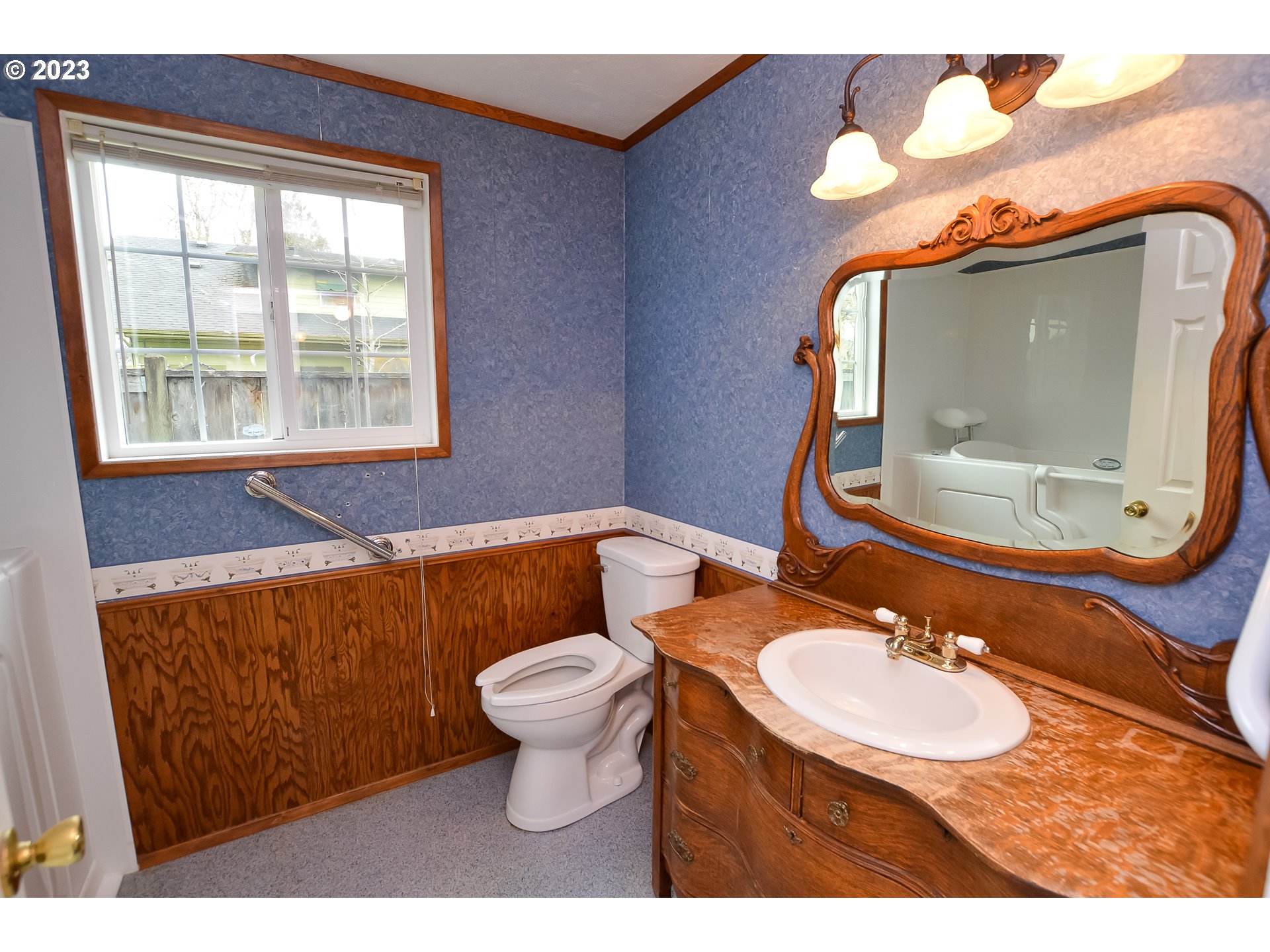 2470 16th Street Springfield, OR 97477 - Photo 22 of 32 a bathroom with a toilet sink and mirror