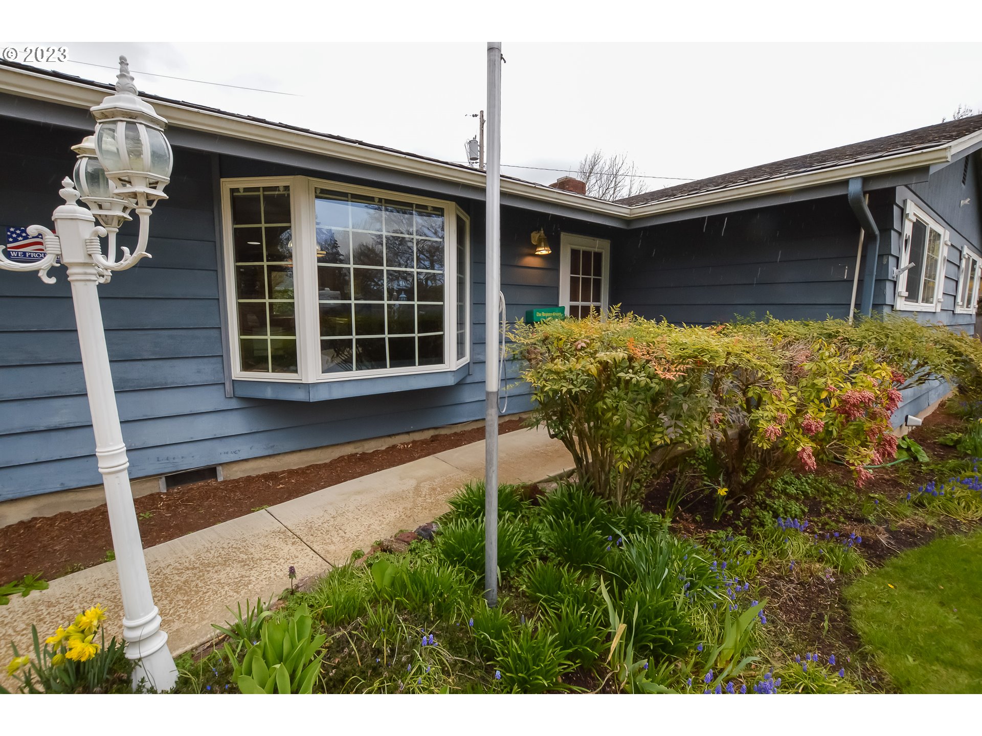 2470 16th Street Springfield, OR 97477 - Photo 3 of 32 a front view of a house with a yard