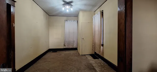 a view of hallway with bathroom