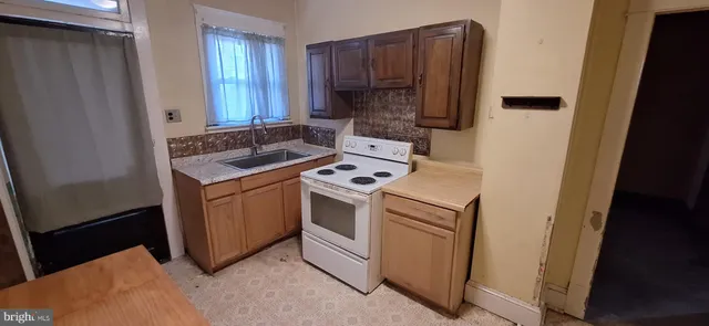 a view of kitchen and utility room