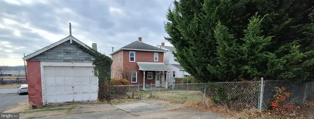 a front view of a house with garage