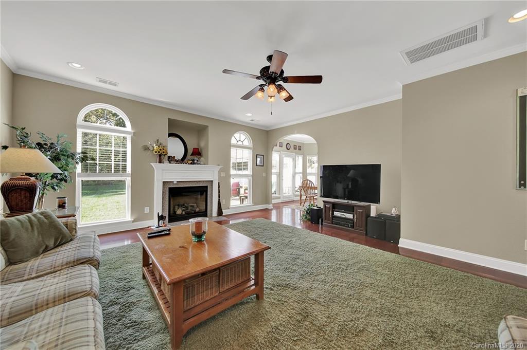 320 Sand Paver Way Fort Mill, SC 29708 - Photo 11 of 42 a living room with furniture a fireplace and a flat screen tv