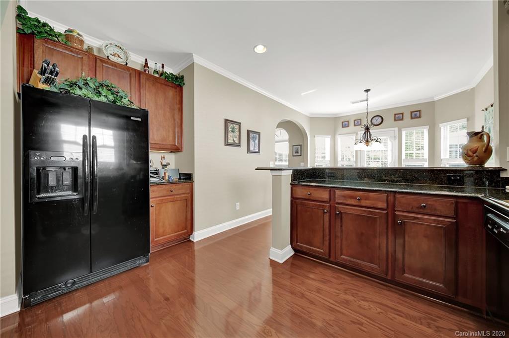 320 Sand Paver Way Fort Mill, SC 29708 - Photo 15 of 42 a kitchen with stainless steel appliances granite countertop a refrigerator and a sink