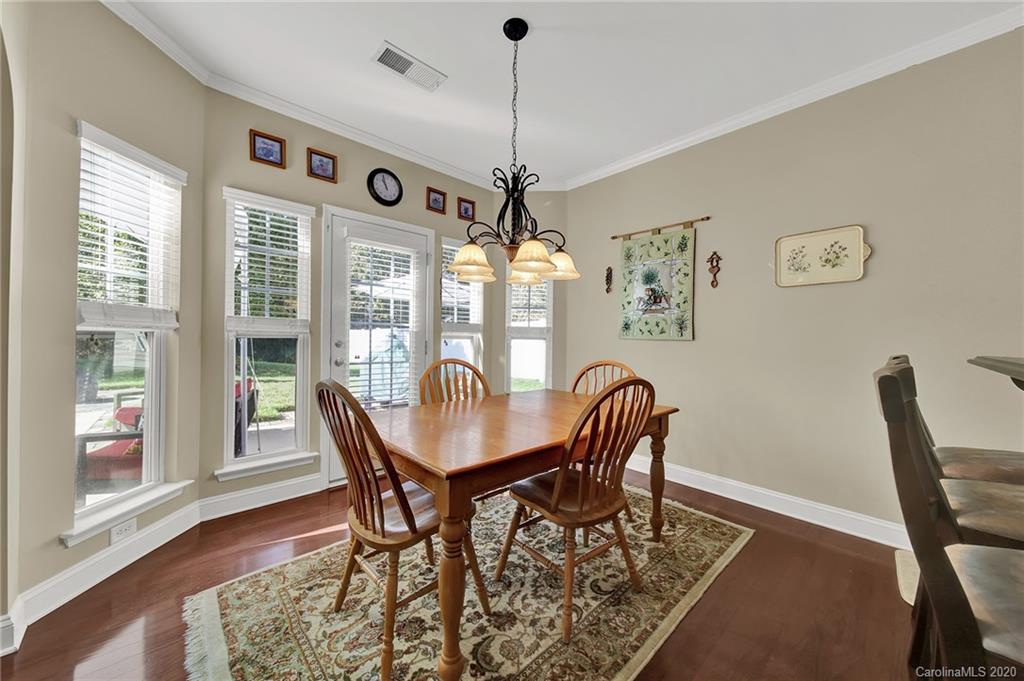 320 Sand Paver Way Fort Mill, SC 29708 - Photo 16 of 42 a view of a dining room with furniture window and wooden floor