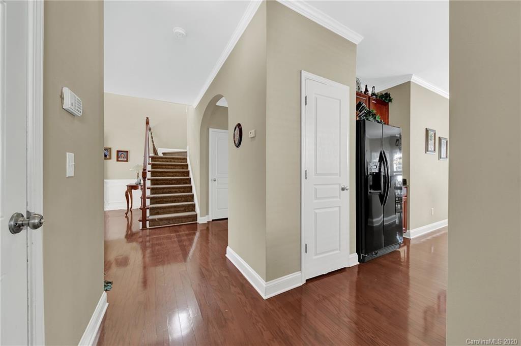 320 Sand Paver Way Fort Mill, SC 29708 - Photo 19 of 42 a view of a hallway with wooden floor and cabinets