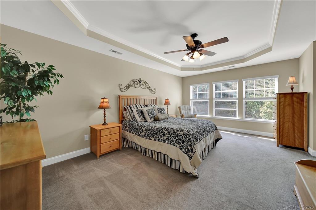 320 Sand Paver Way Fort Mill, SC 29708 - Photo 20 of 42 a bedroom with a bed dresser and a window