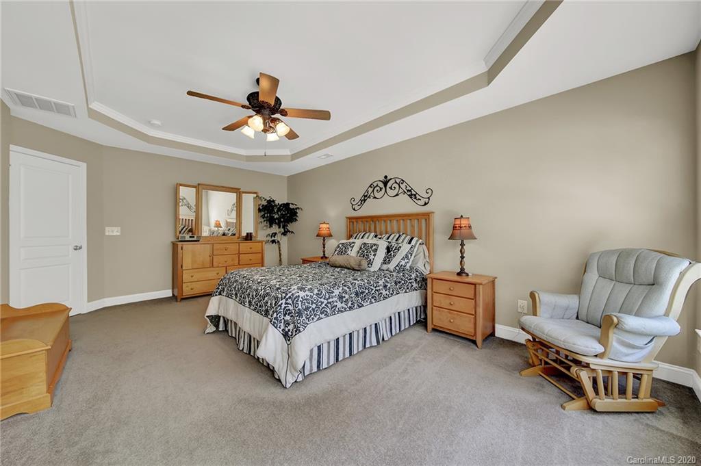 320 Sand Paver Way Fort Mill, SC 29708 - Photo 21 of 42 a bedroom with a bed couch and window
