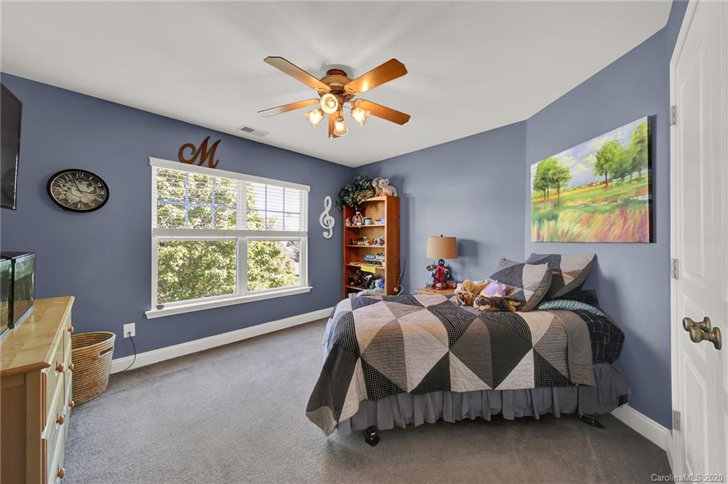 320 Sand Paver Way Fort Mill, SC 29708 - Photo 27 of 42 a bed room with a bed and a fish tank
