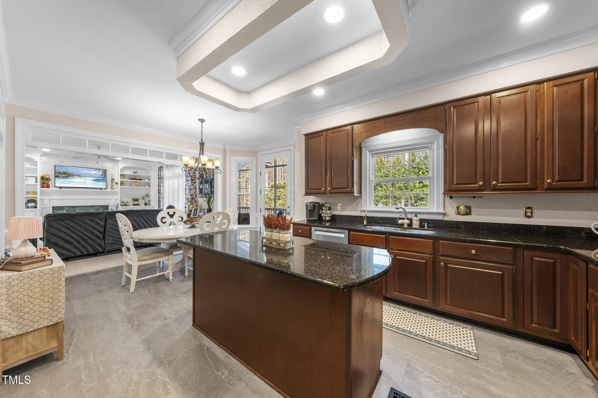 12016 Pembridge Lane Raleigh, NC 27613 - Photo 16 of 52 a large kitchen with lots of counter space and windows