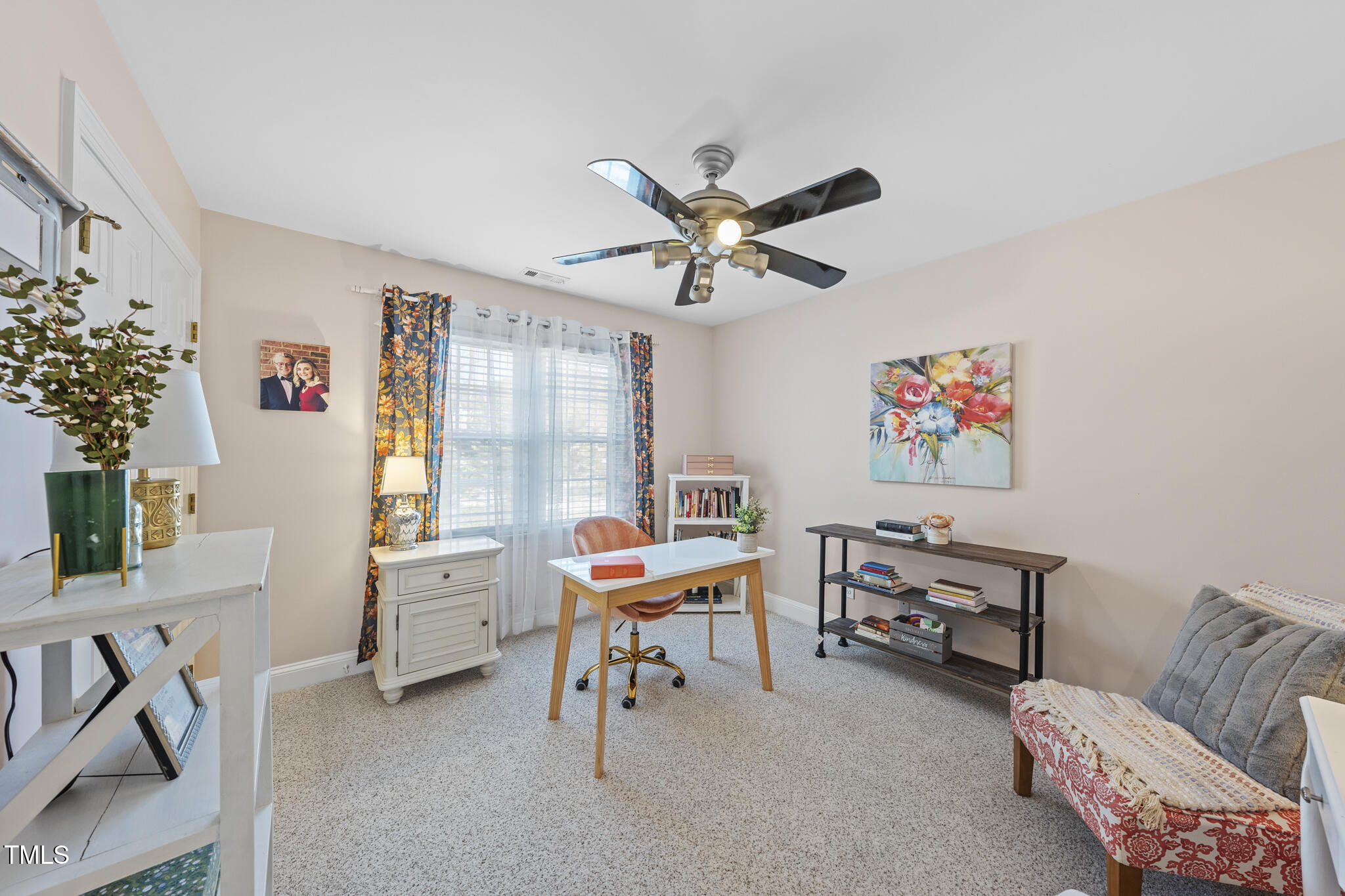 12016 Pembridge Lane Raleigh, NC 27613 - Photo 28 of 52 a living room with furniture and a window