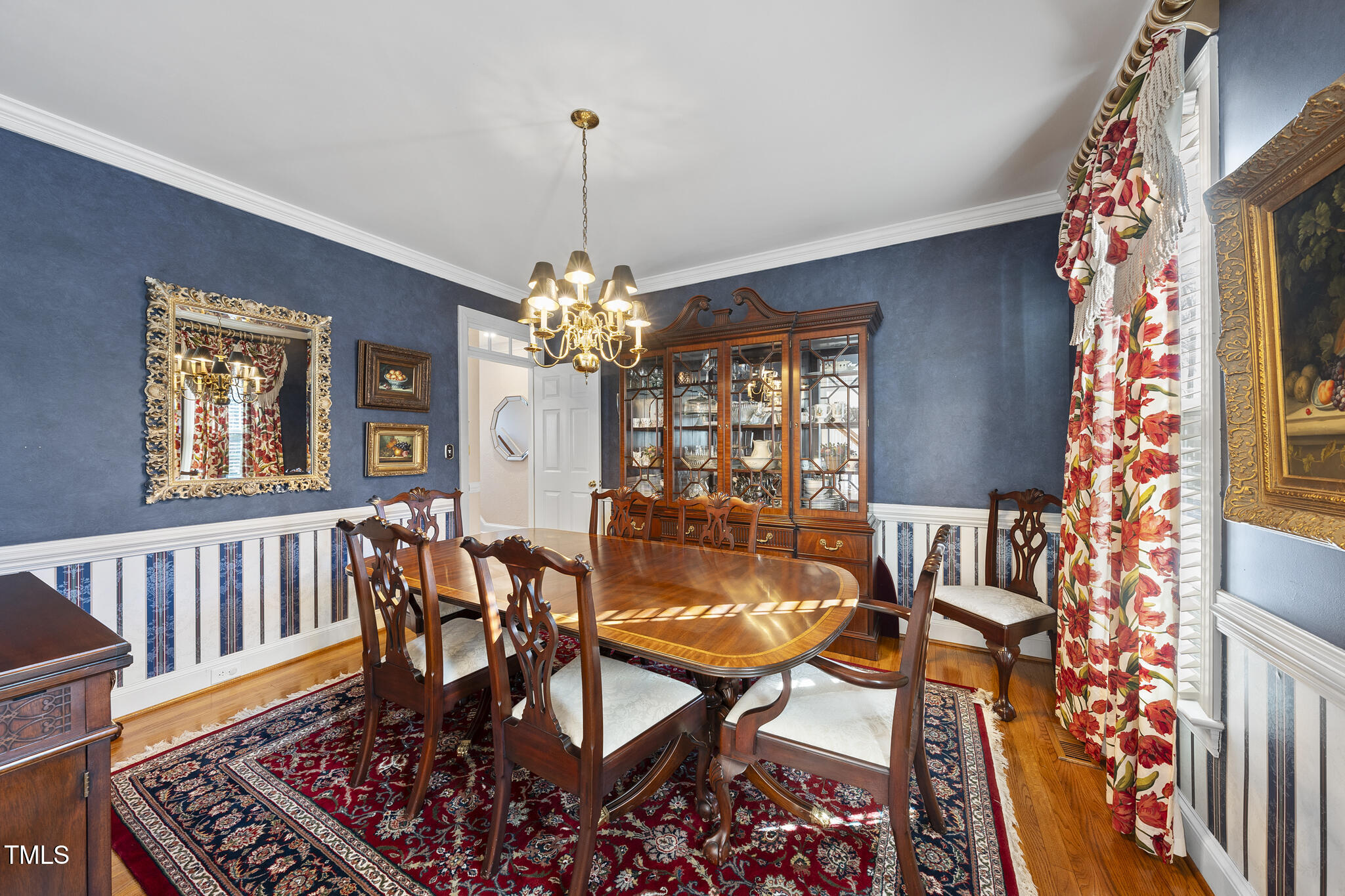 12016 Pembridge Lane Raleigh, NC 27613 - Photo 3 of 52 a view of a dining room with furniture window and wooden floor