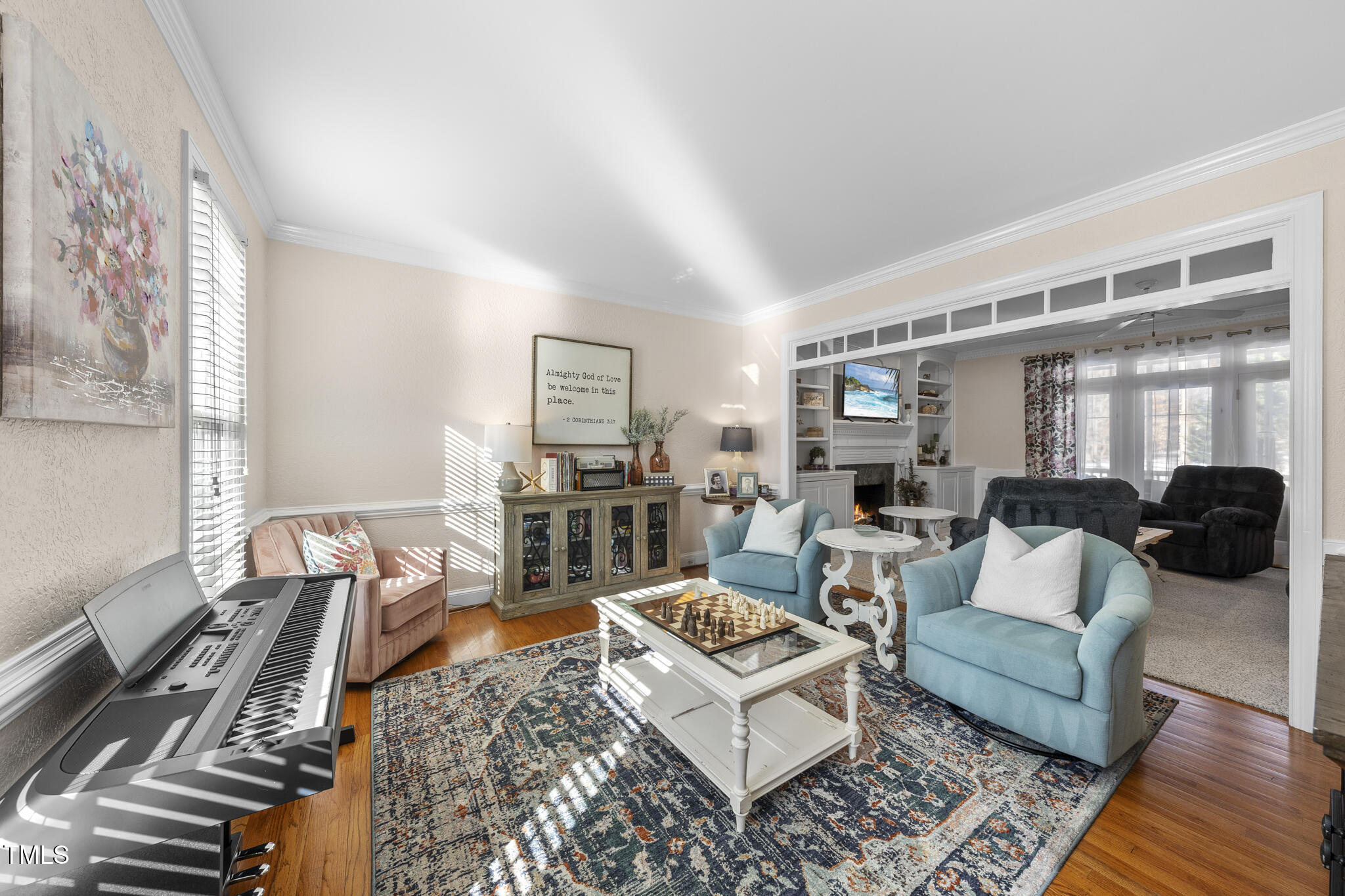 12016 Pembridge Lane Raleigh, NC 27613 - Photo 5 of 52 a living room with furniture and a rug
