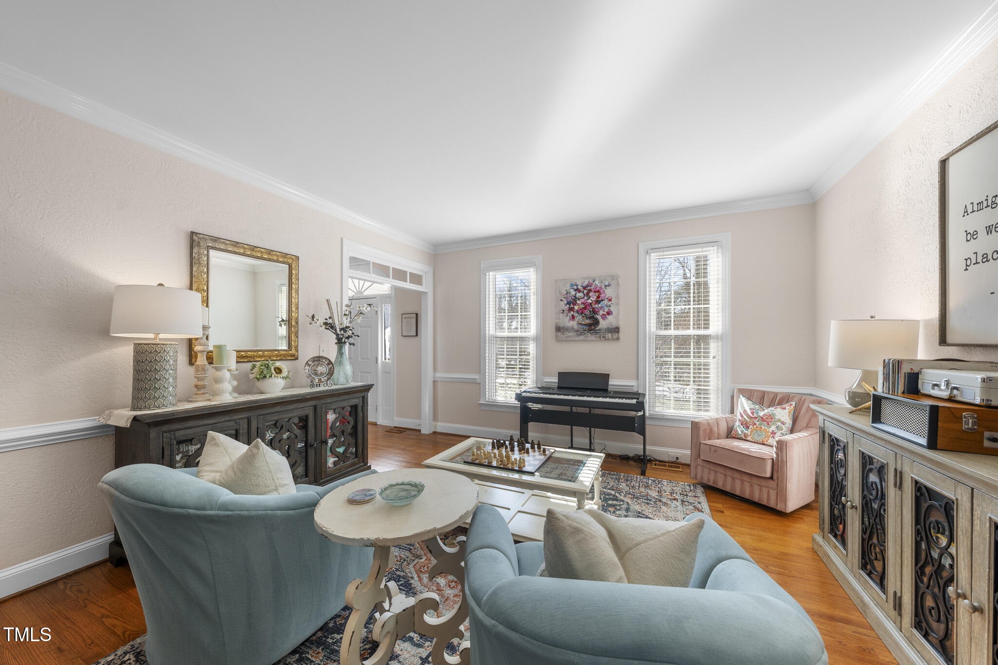 12016 Pembridge Lane Raleigh, NC 27613 - Photo 6 of 52 a living room with furniture and a wooden floor