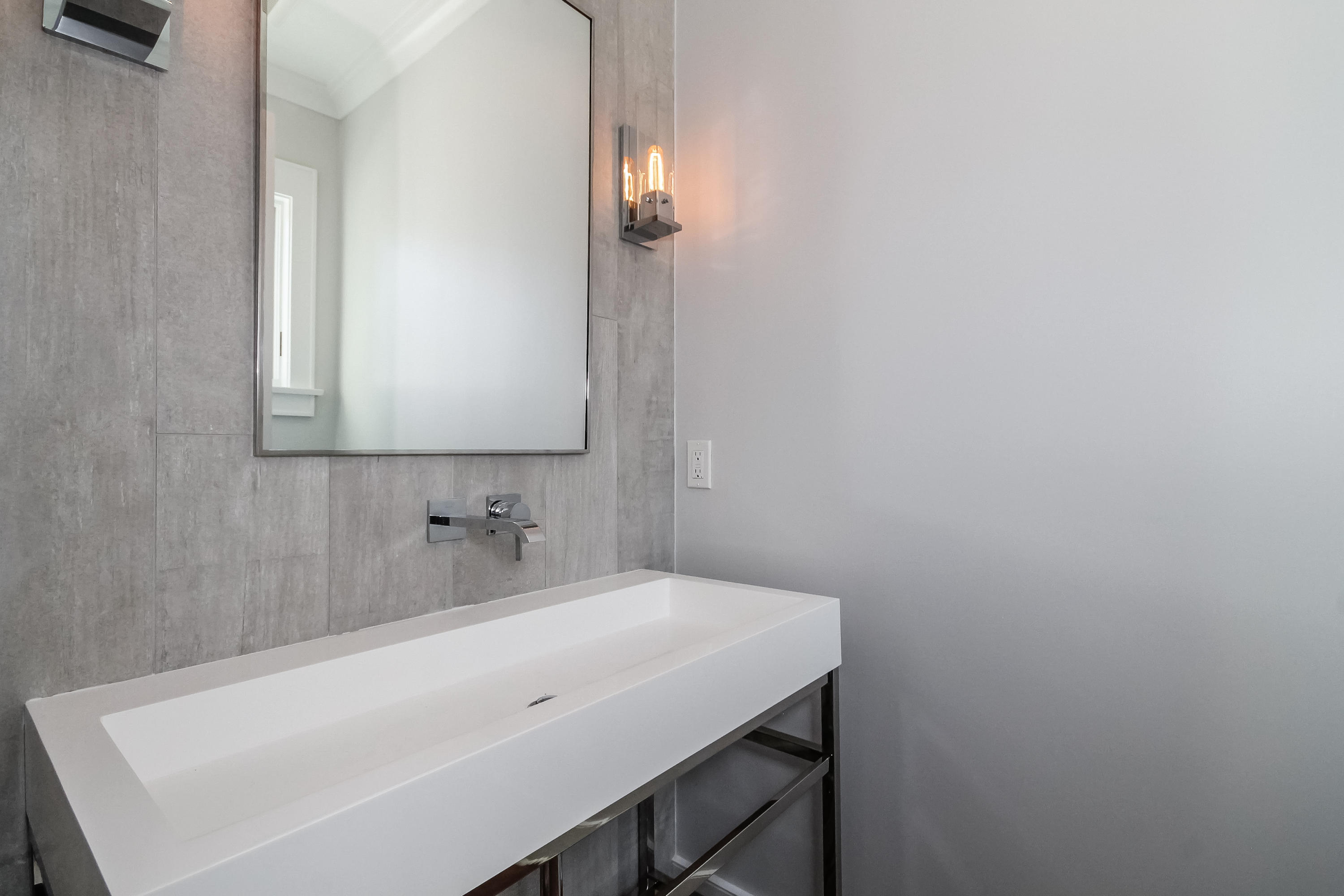 30 Relihan Road Darien, CT 06820 - Photo 19 of 47 a bathroom with a sink and a mirror