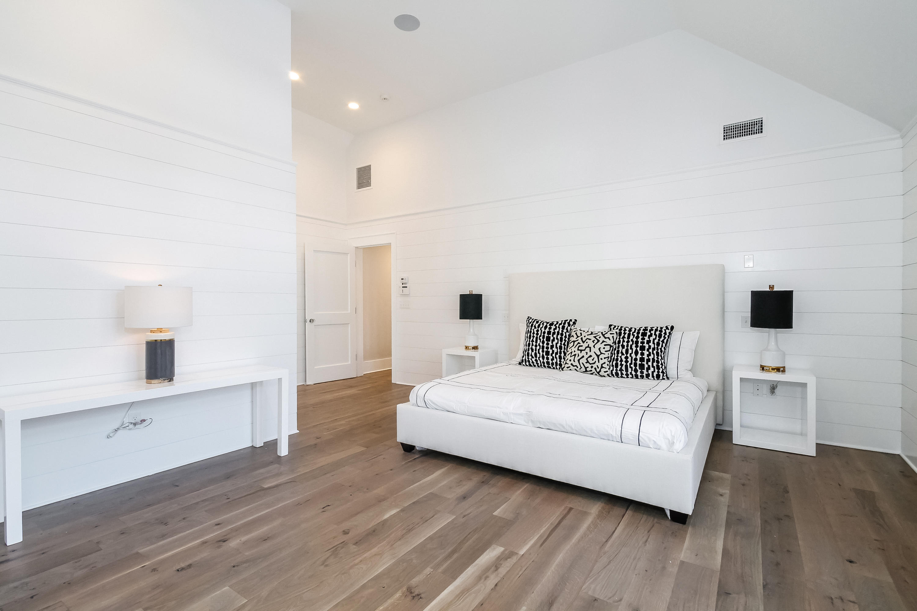 30 Relihan Road Darien, CT 06820 - Photo 21 of 47 a spacious bedroom with a bed and a wooden floor