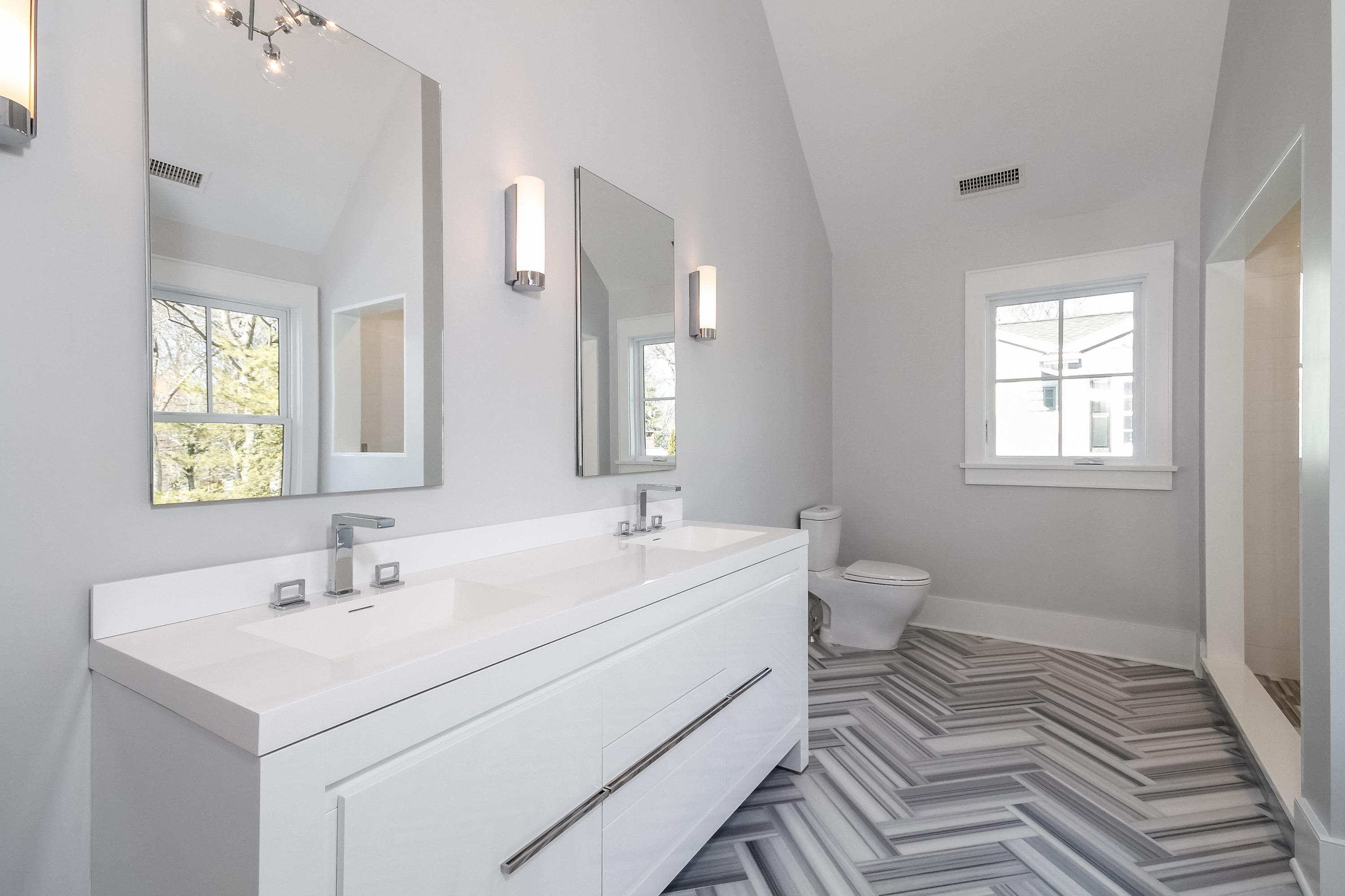 30 Relihan Road Darien, CT 06820 - Photo 25 of 47 a bathroom with a sink toilet and mirror