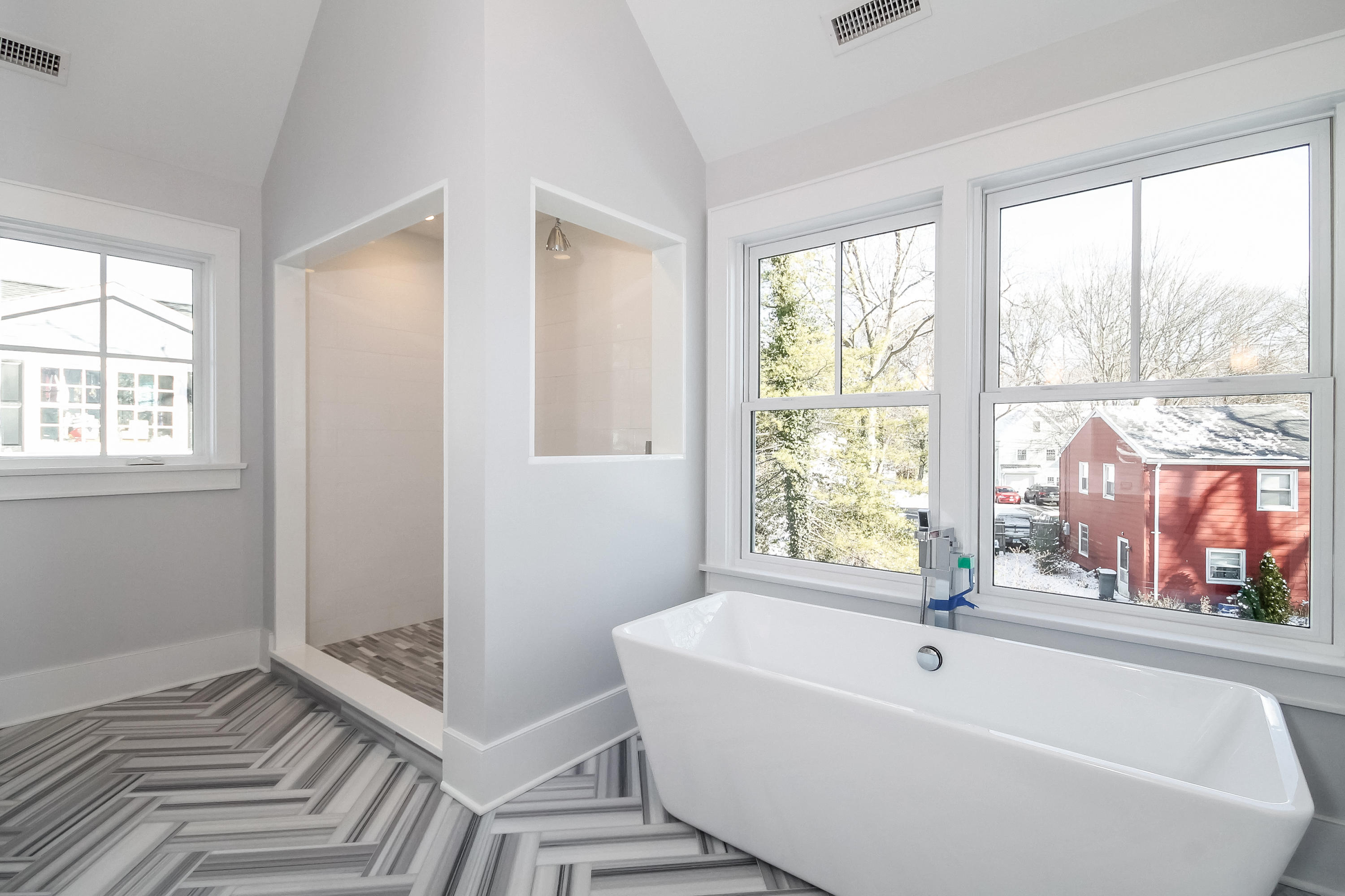 30 Relihan Road Darien, CT 06820 - Photo 26 of 47 a bath tub sitting in a bathroom next to a window