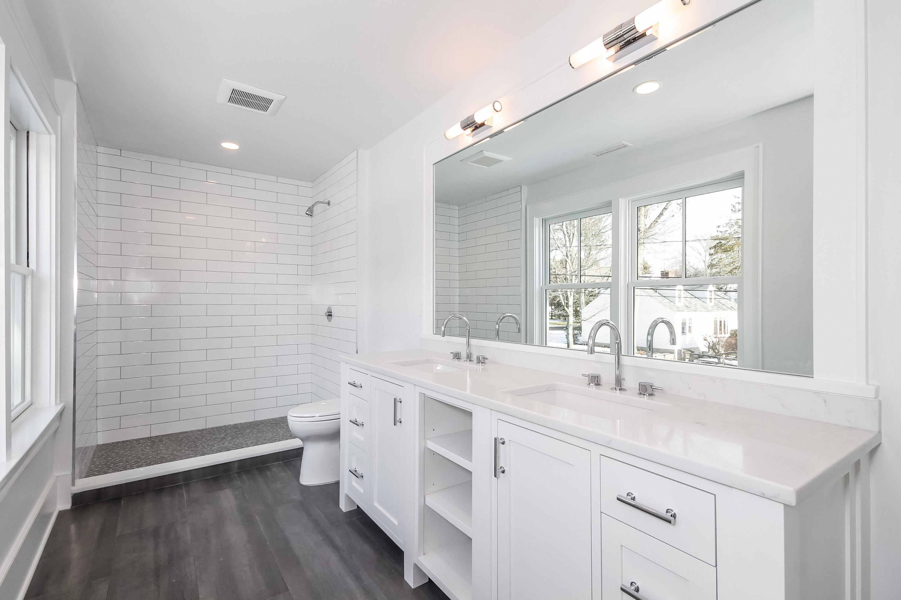 30 Relihan Road Darien, CT 06820 - Photo 38 of 47 a bathroom with a double vanity sink toilet and shower