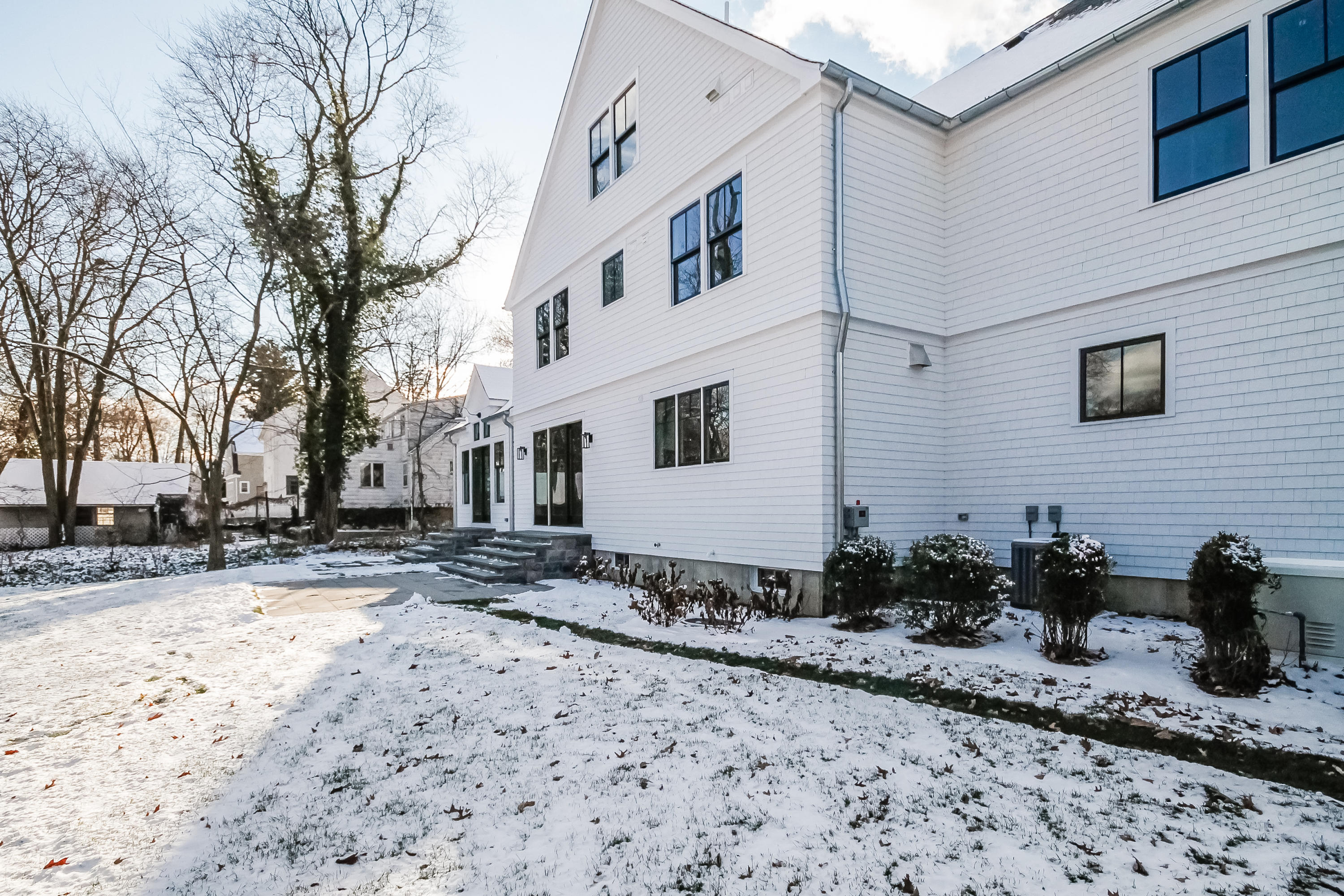 30 Relihan Road Darien, CT 06820 - Photo 47 of 47 a backyard of a house with large trees and buildings