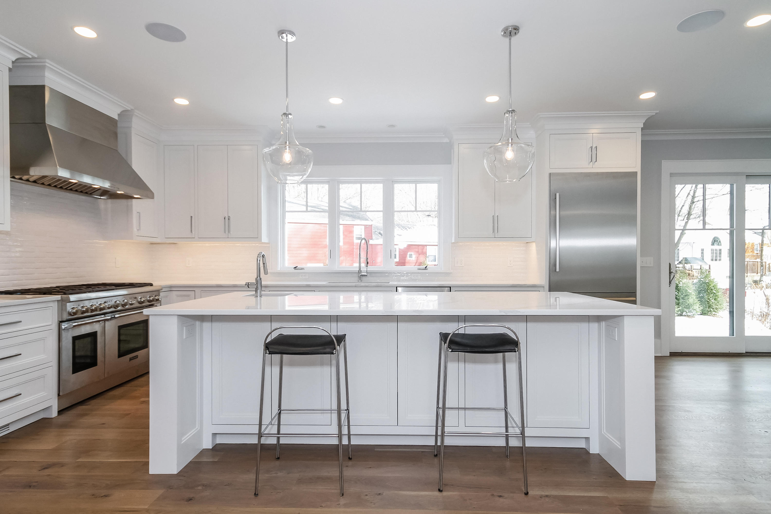 30 Relihan Road Darien, CT 06820 - Photo 9 of 47 a kitchen with stainless steel appliances granite countertop a stove a sink and a refrigerator