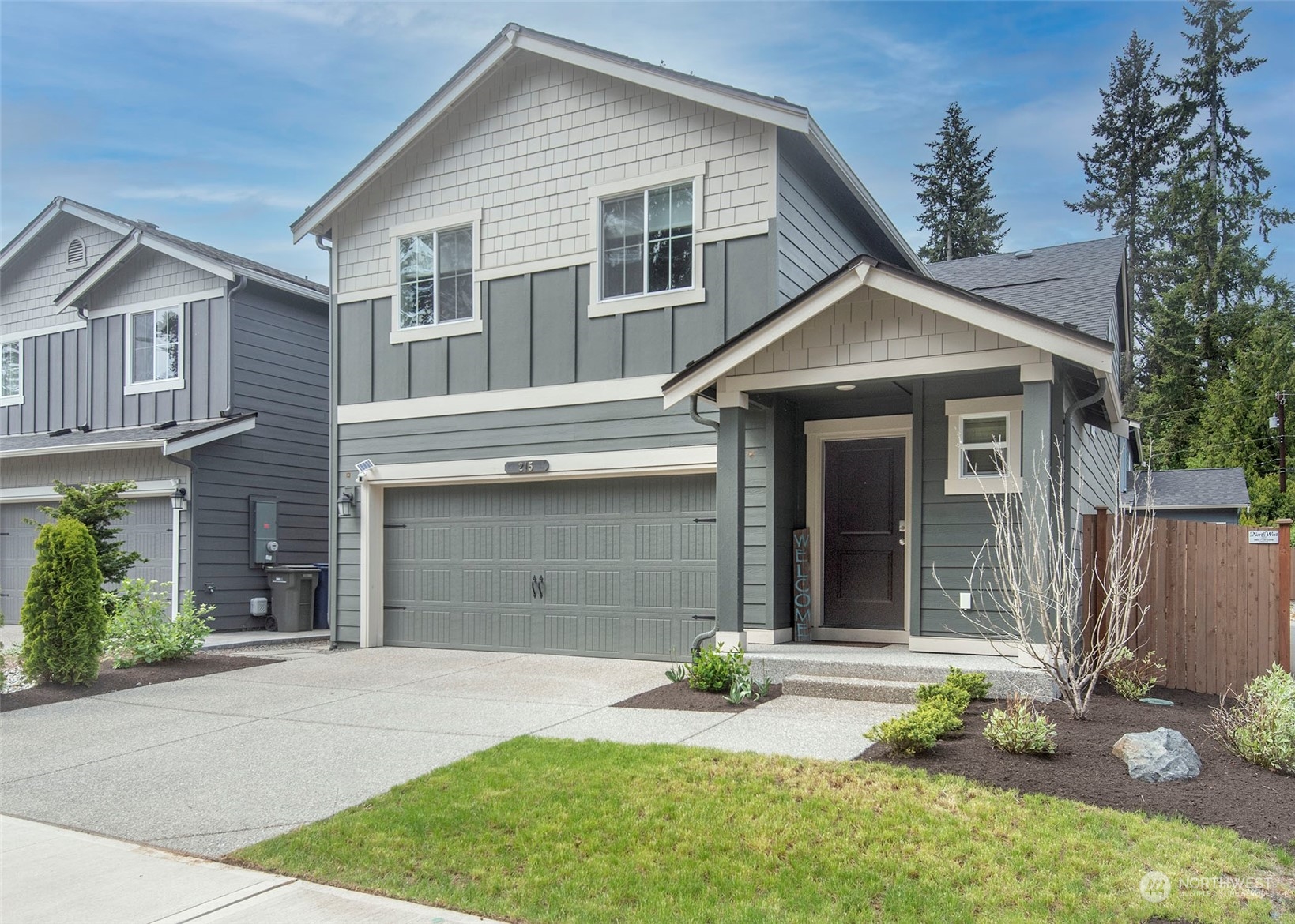 215 169th Place Southwest Bothell, WA 98012 - Photo 1 of 30 a front view of a house with a yard