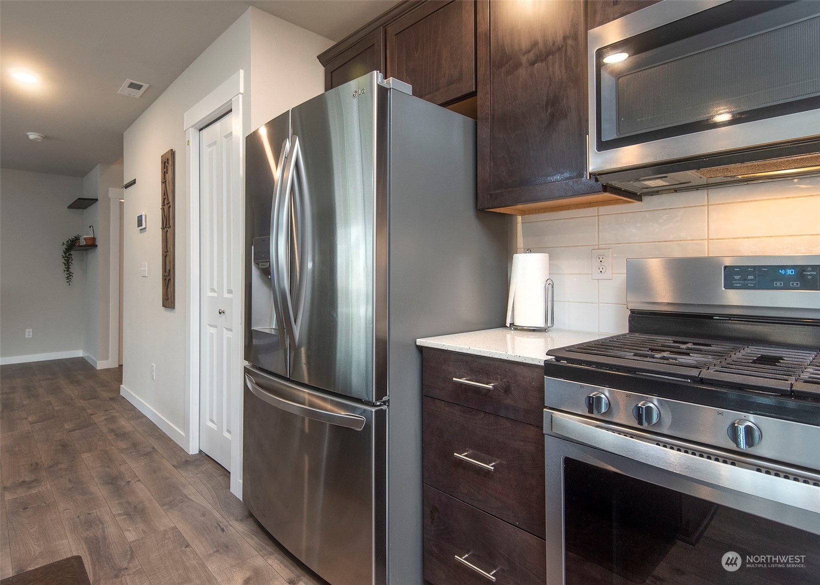 215 169th Place Southwest Bothell, WA 98012 - Photo 13 of 30 a kitchen with stainless steel appliances granite countertop a refrigerator and a stove