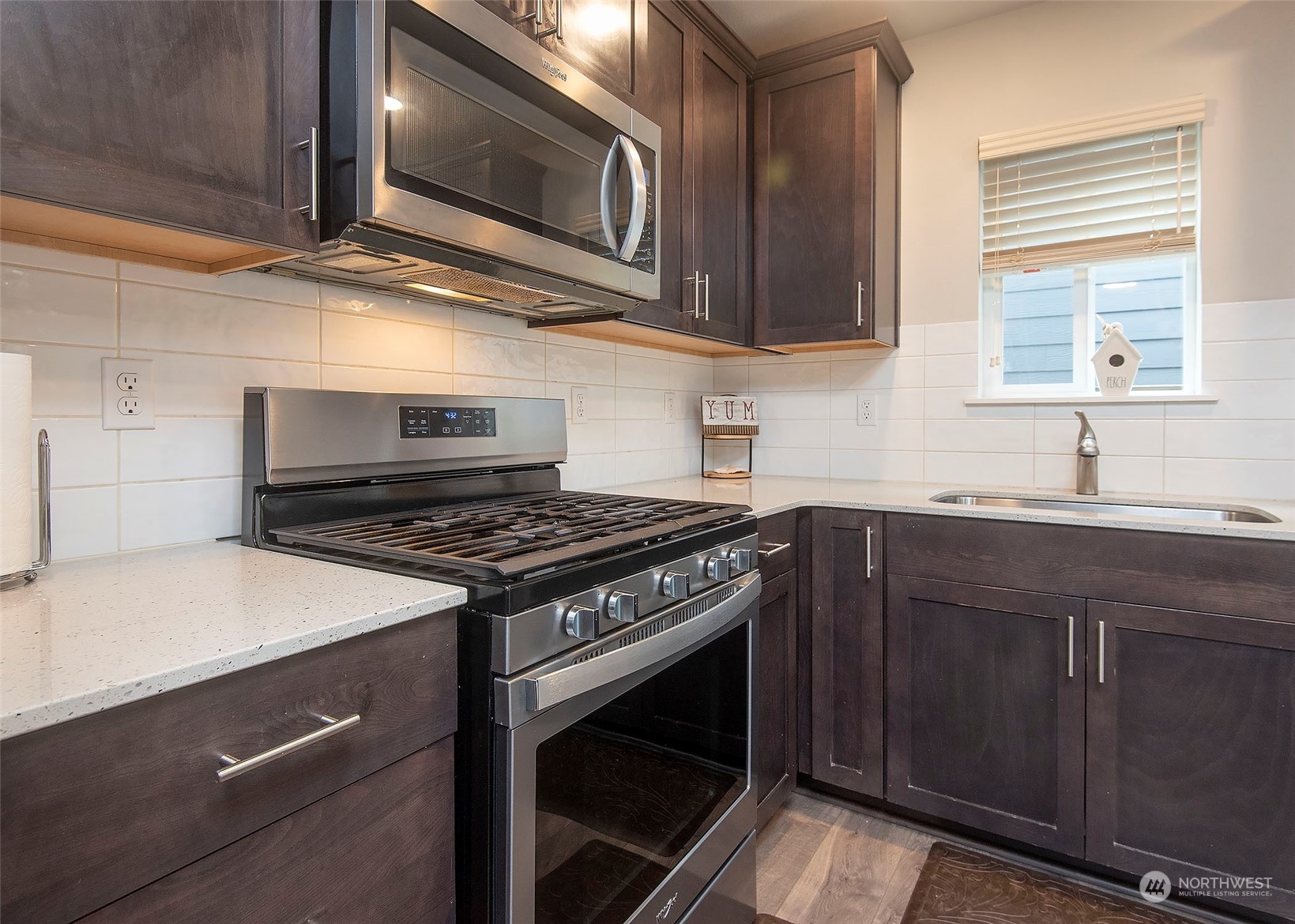 215 169th Place Southwest Bothell, WA 98012 - Photo 14 of 30 a kitchen with stainless steel appliances granite countertop a stove and a microwave