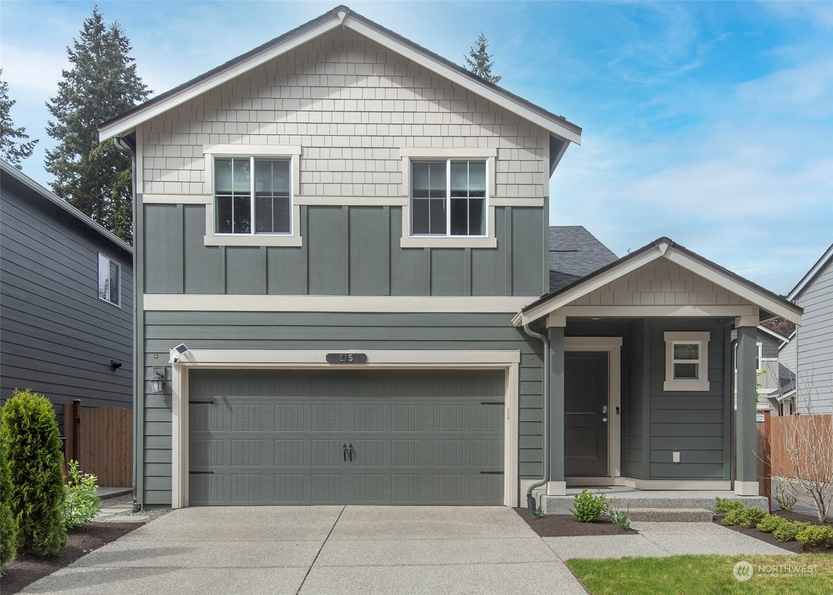 215 169th Place Southwest Bothell, WA 98012 - Photo 2 of 30 a front view of a house with a garage