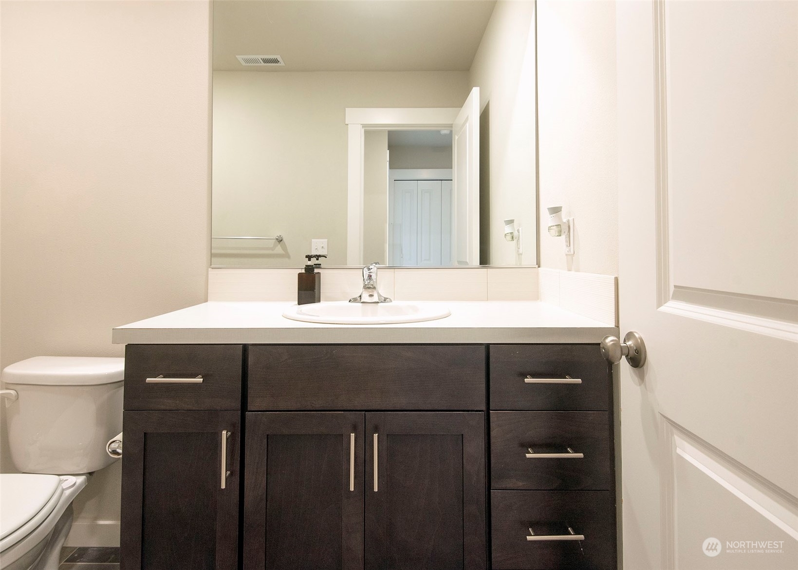 215 169th Place Southwest Bothell, WA 98012 - Photo 24 of 30 a bathroom with a sink vanity and a toilet