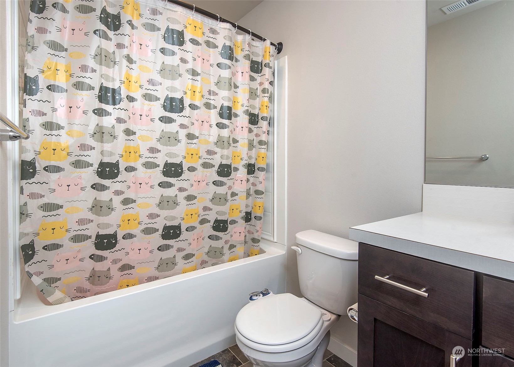 215 169th Place Southwest Bothell, WA 98012 - Photo 25 of 30 a white toilet sitting next to a shower curtain