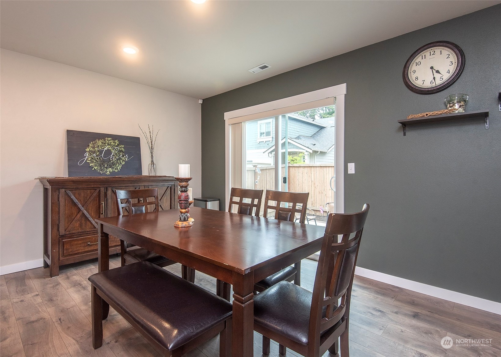 215 169th Place Southwest Bothell, WA 98012 - Photo 8 of 30 a view of a dining room with furniture window and wooden floor