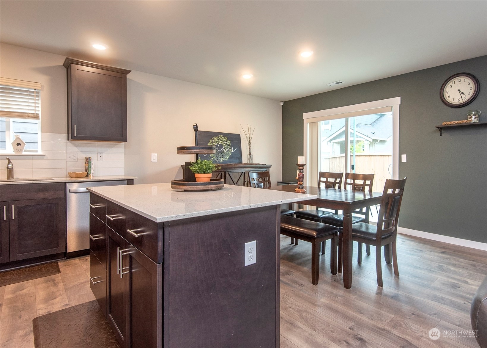 215 169th Place Southwest Bothell, WA 98012 - Photo 9 of 30 a kitchen with a table chairs sink and cabinets