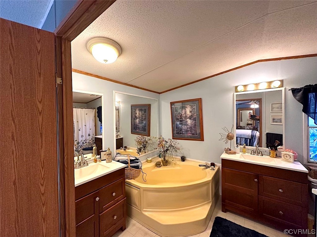 13504 Scotts Road Dewitt, VA 23840 - Photo 13 of 50 a bathroom with a sink double vanity and a mirror