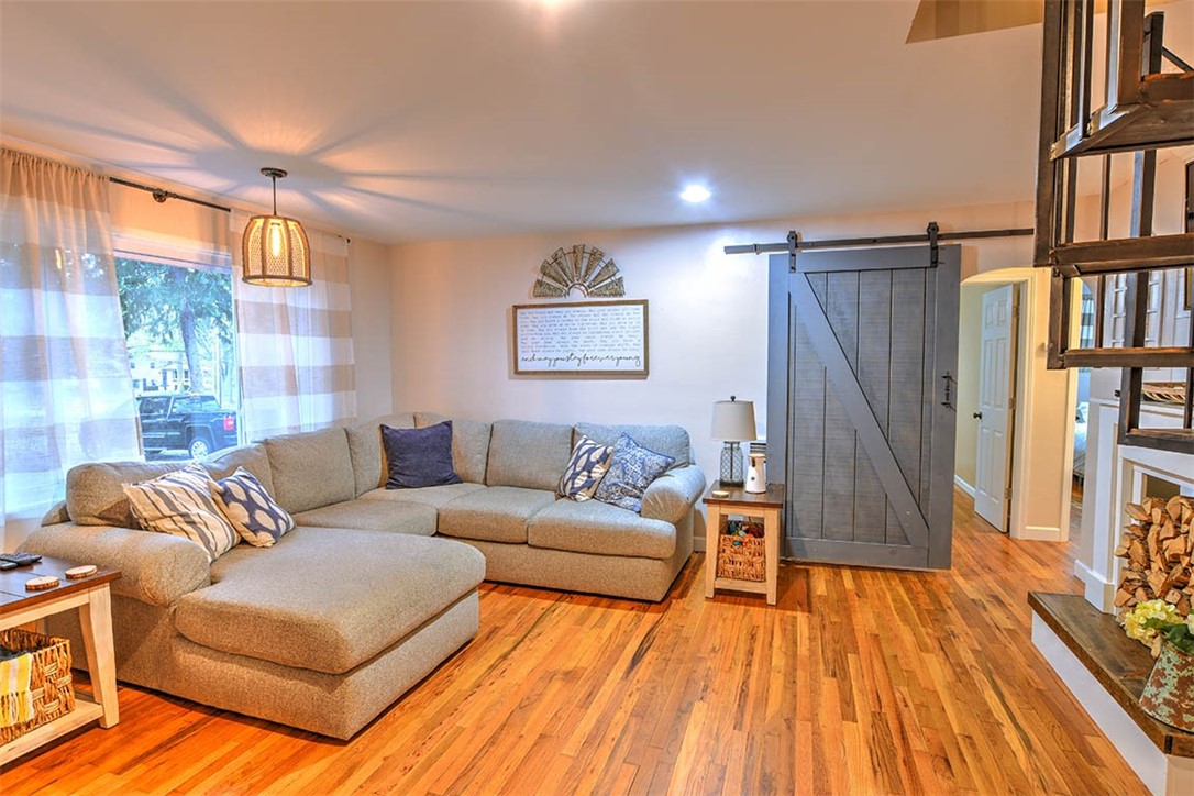 1460 West Ash Avenue Decatur, IL 62526 - Photo 4 of 24 a living room with furniture and a wooden floor