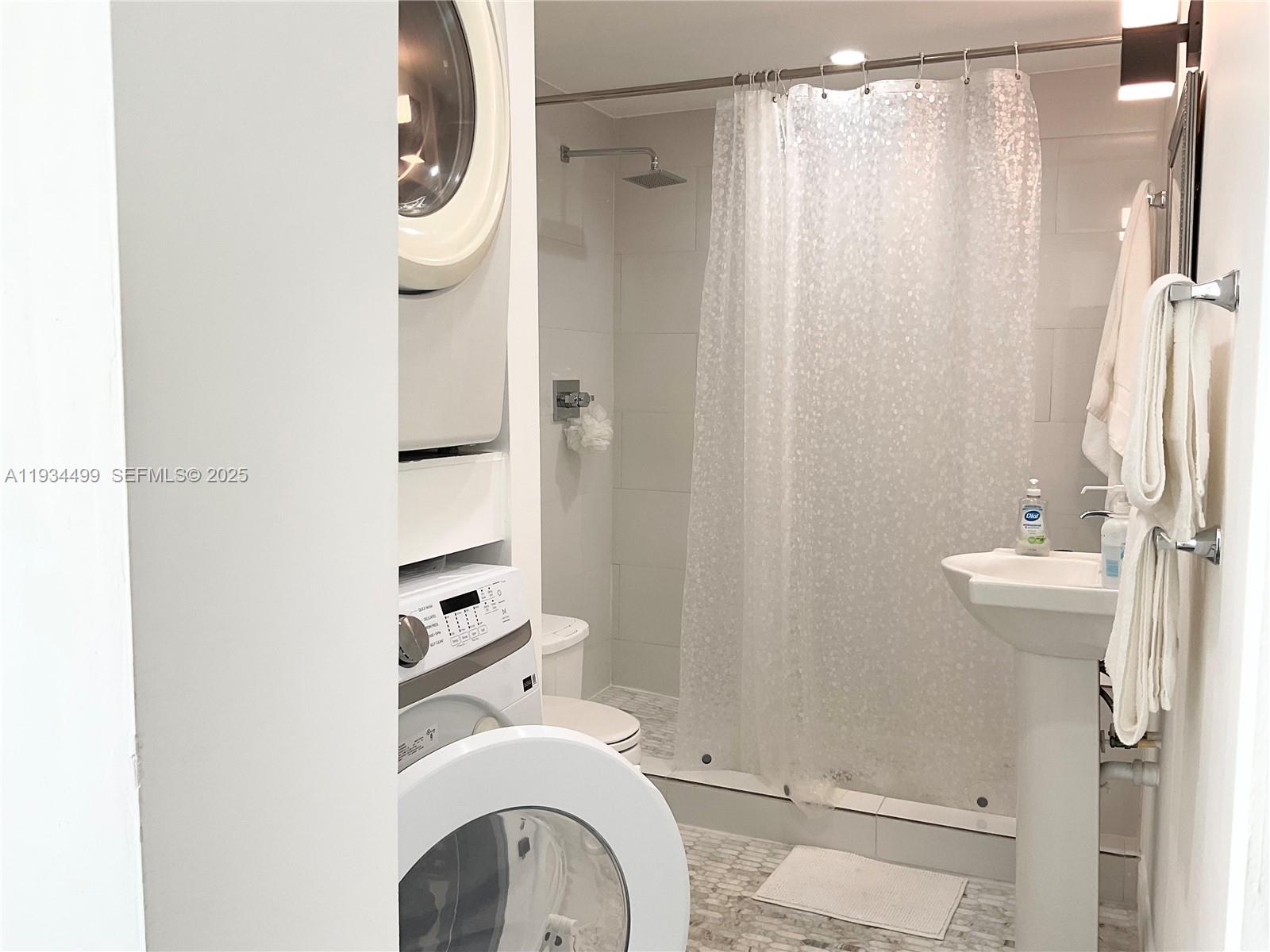 161 Northwest 145th Street Miami, FL 33168 - Photo 11 of 39 a bathroom with a sink a toilet and shower